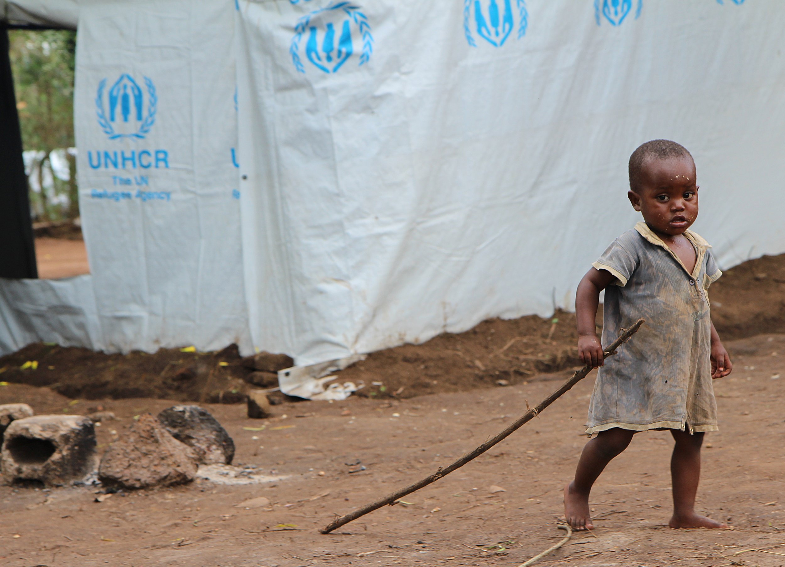 A Burundian refugee plays in a Rwandan refugee camp.