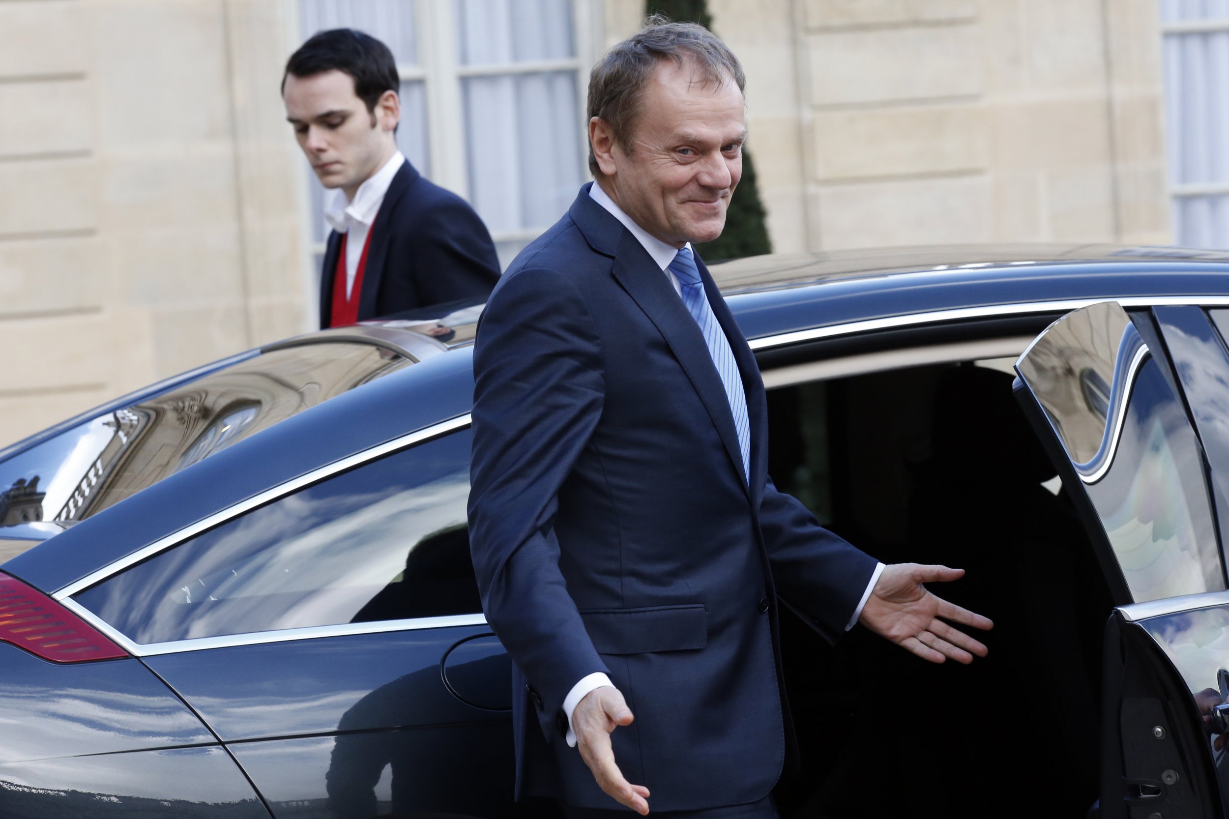 EU Council President Donald Tusk leaves the Elysee Palace in Paris.