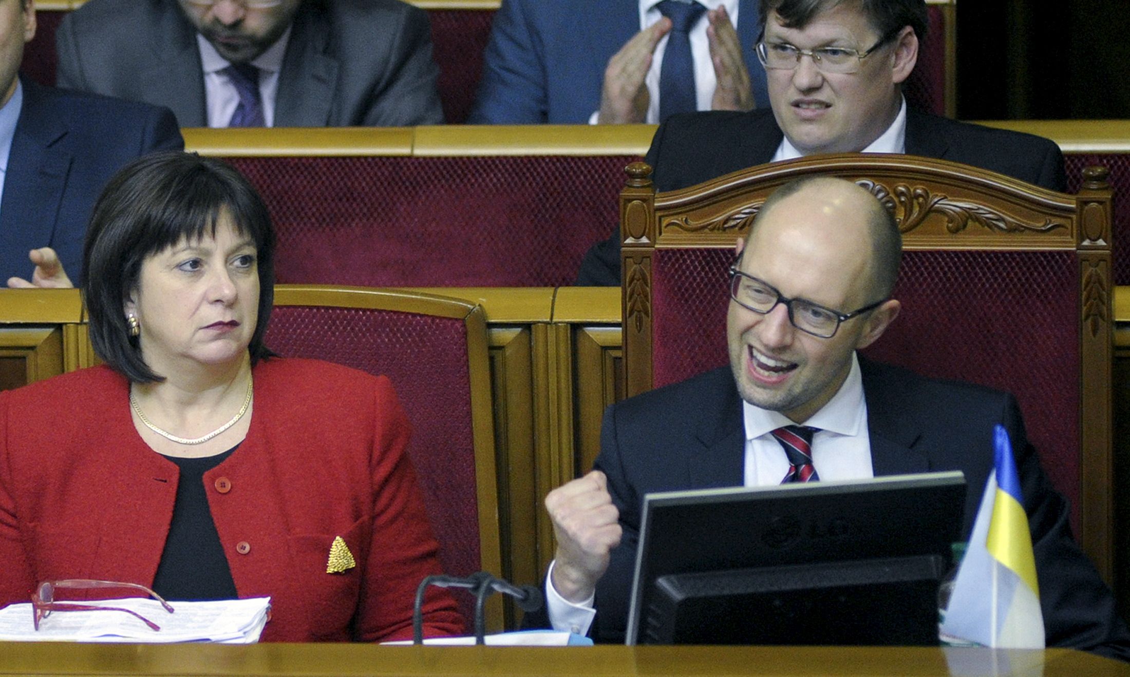 Yatsenyuk punches the air in celebration in parliament