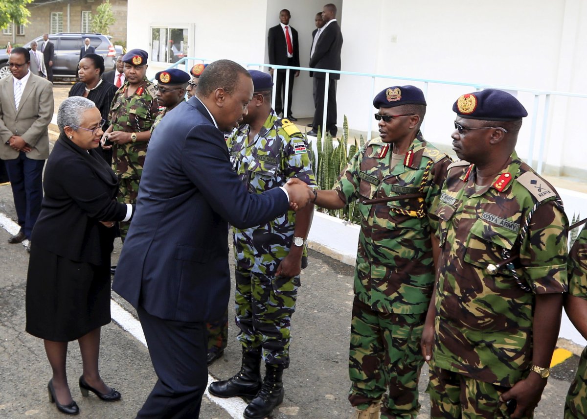 Uhuru Kenyatta greets military officers after Al-Shabab attack.