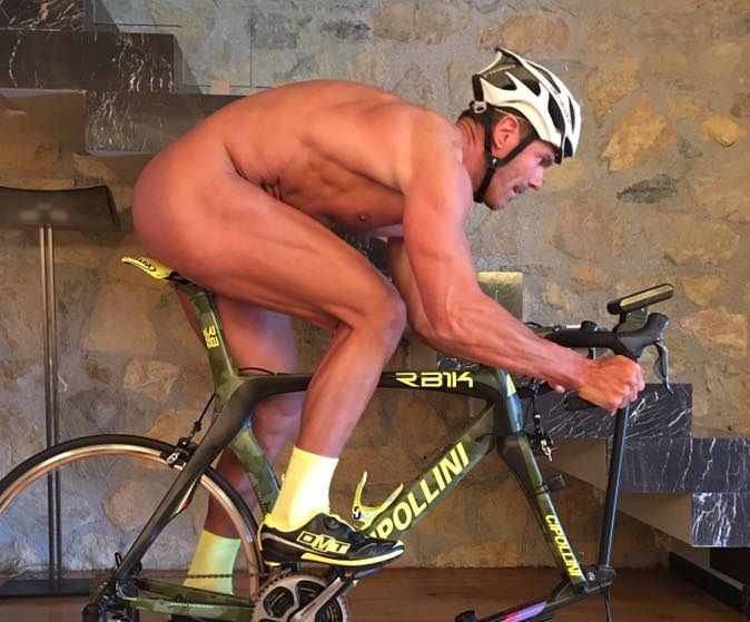 Mario Cipollini riding naked on his indoor bike.