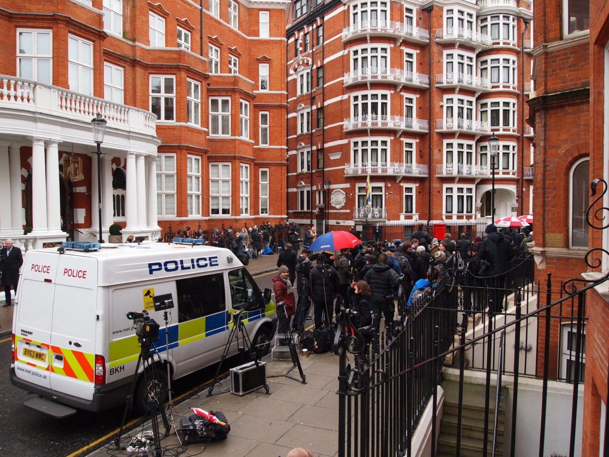 Assange embassy police and press gather outside