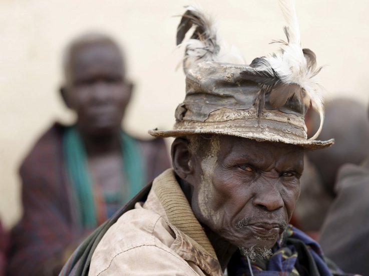 A Karamojong tribesman waits to vote in Uganda's elections. A Karamojong tribesman waits to vote in Uganda's elections.