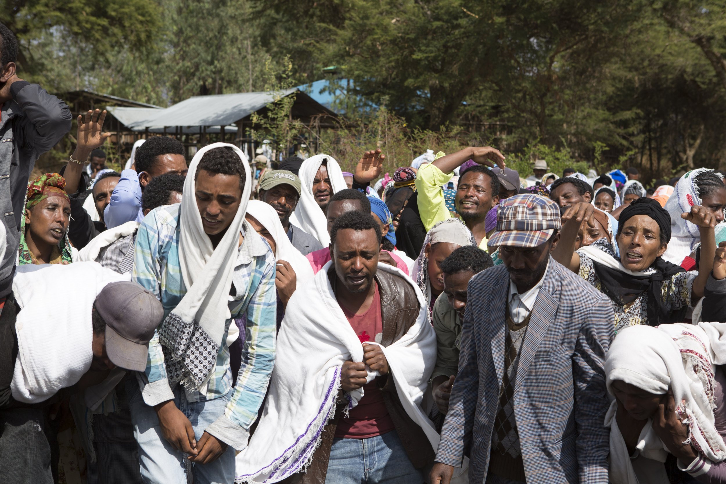 People mourn an alleged Oromo protester shot dead by Ethiopian security forces.