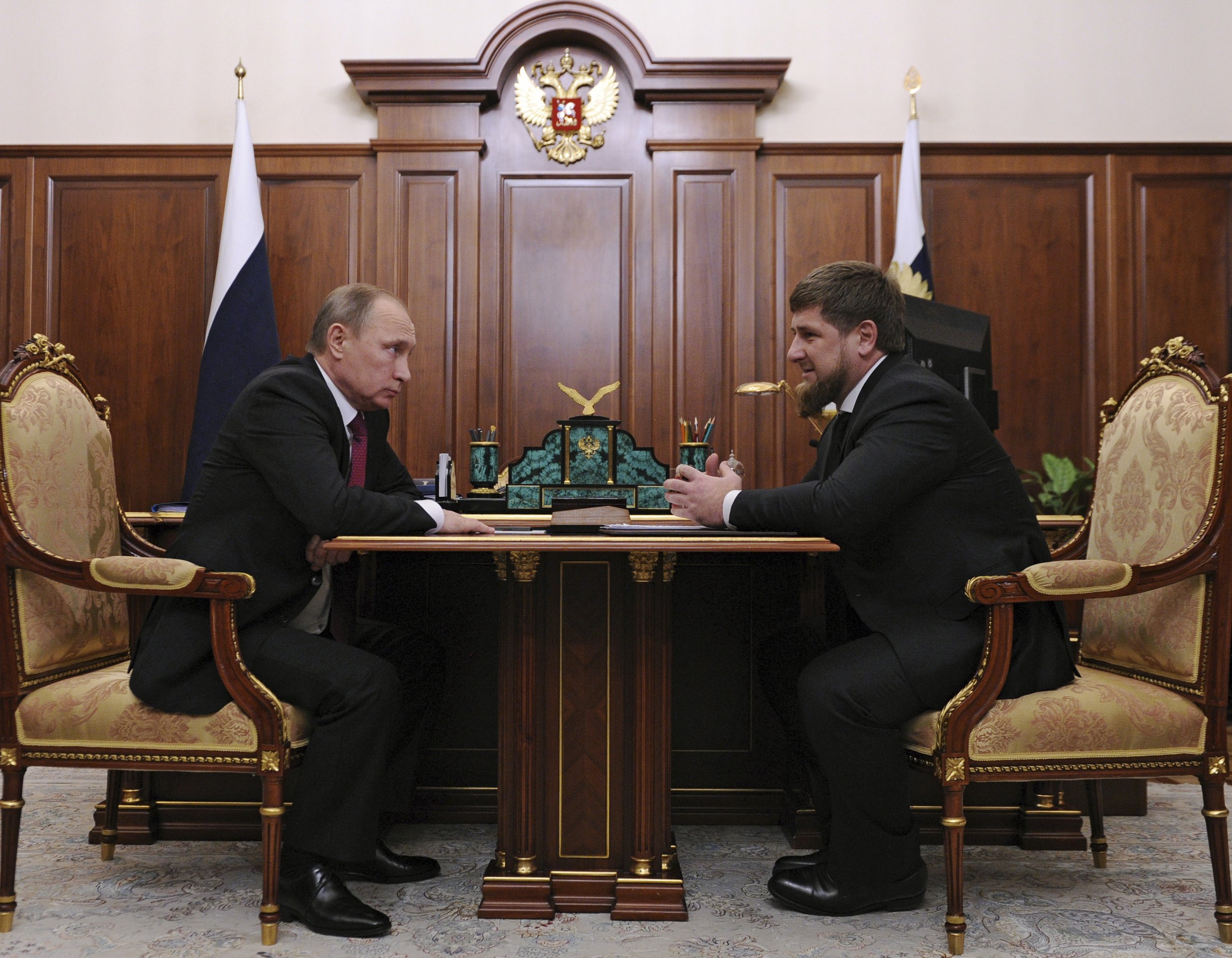 Putin sits opposite Chechen President Kadyrov