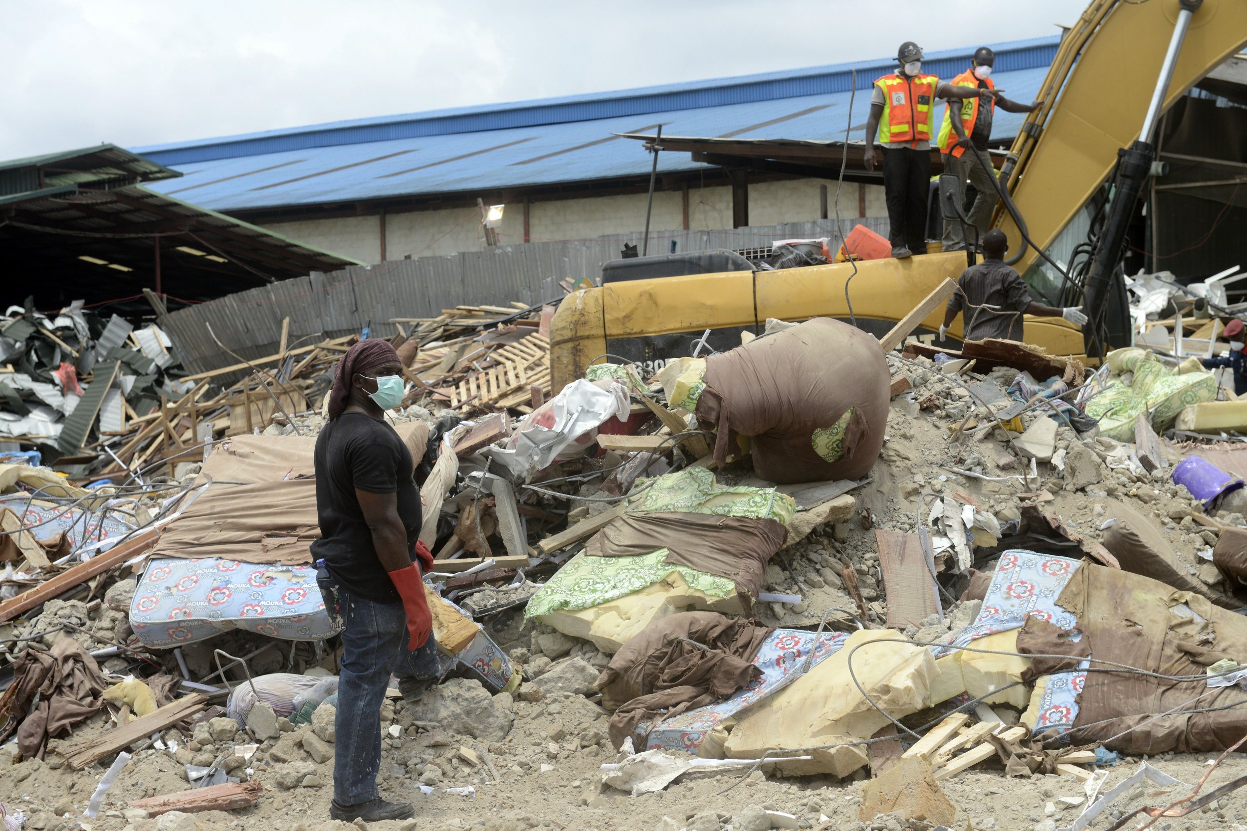 Rescue workers clear rubble from a collapsed church owned by TB Joshua's church in Lagos.