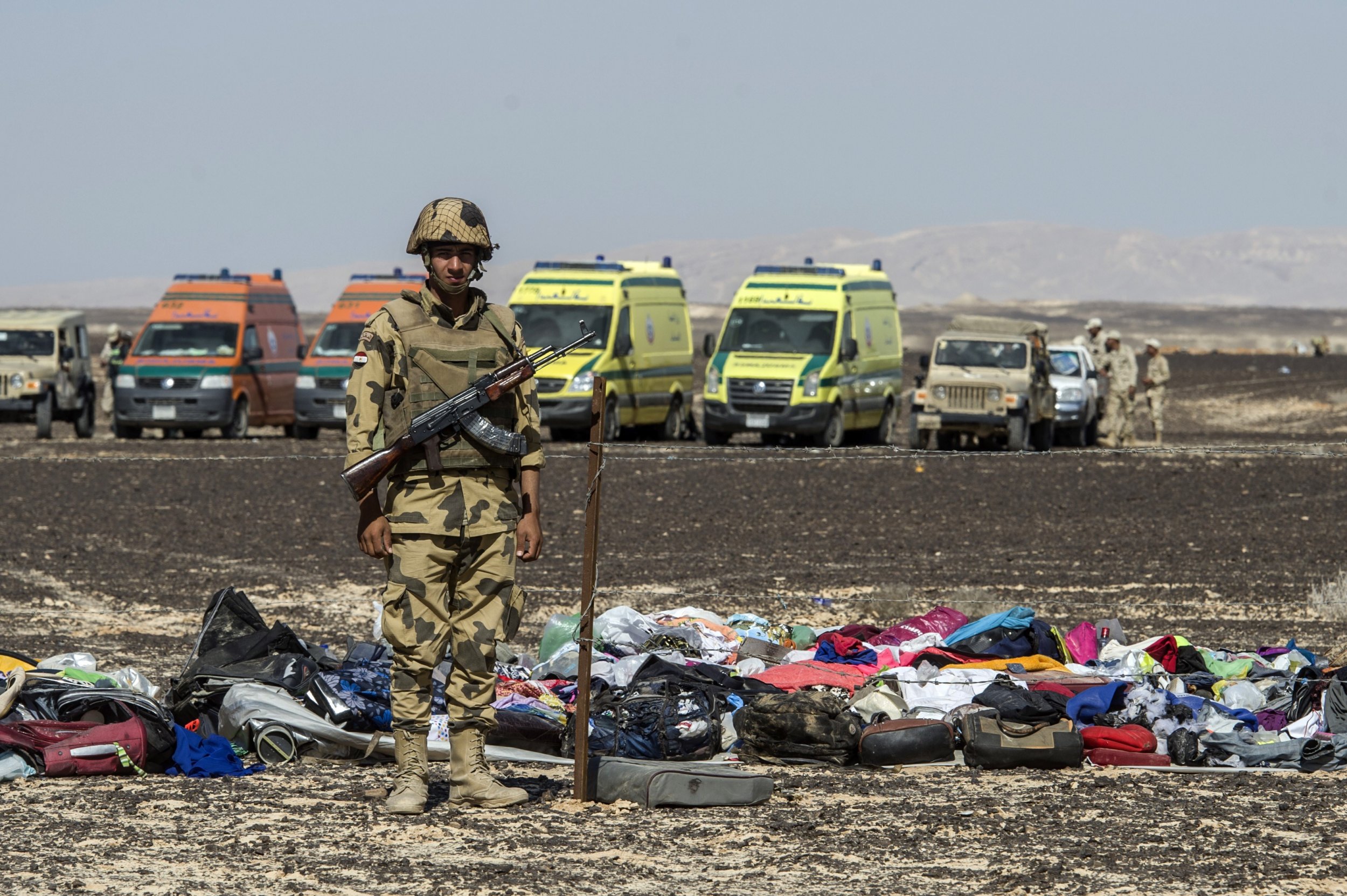 An Egyptian soldier guards luggage of the victims of the Russian plane crash in Sinai.