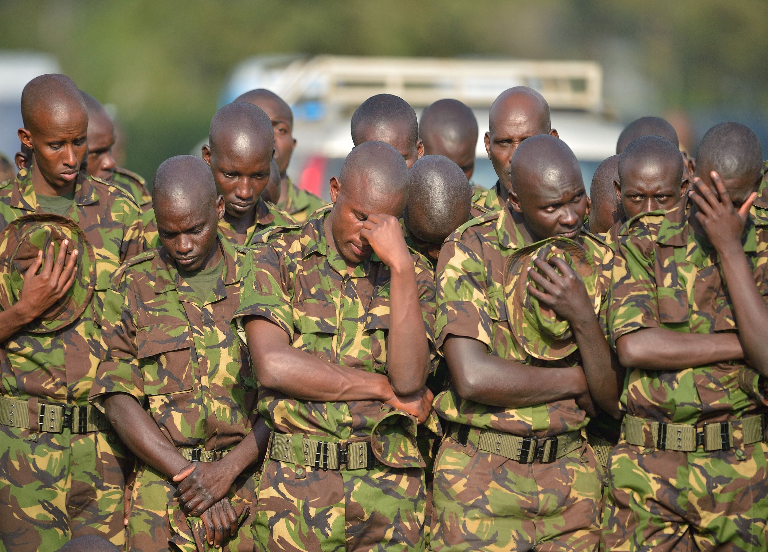 Kenyan soldiers attend a memorial service for victims of an Al-Shabab attack.