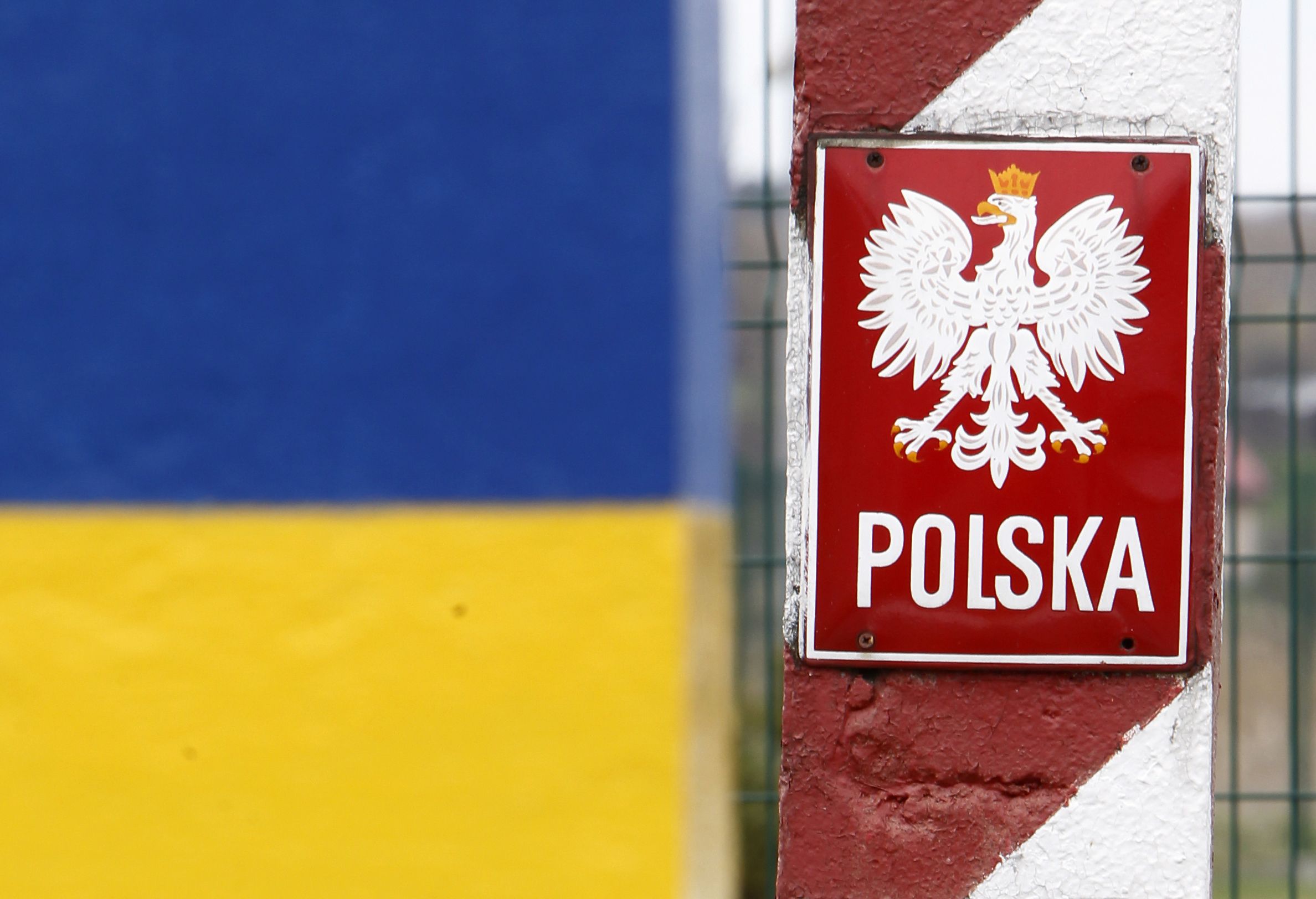 Close up of Ukraine and Poland's border signs