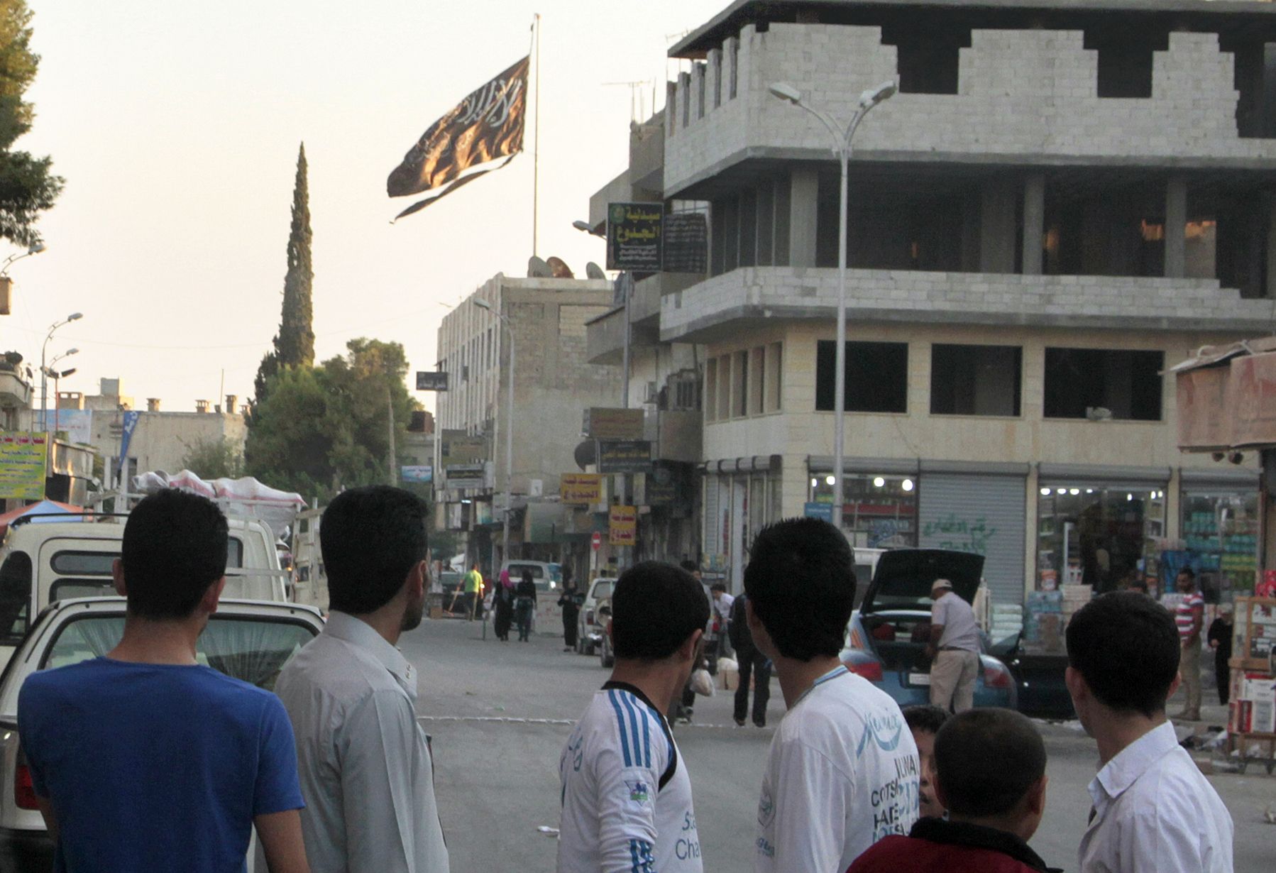 ISIS flag flies in Raqqa.