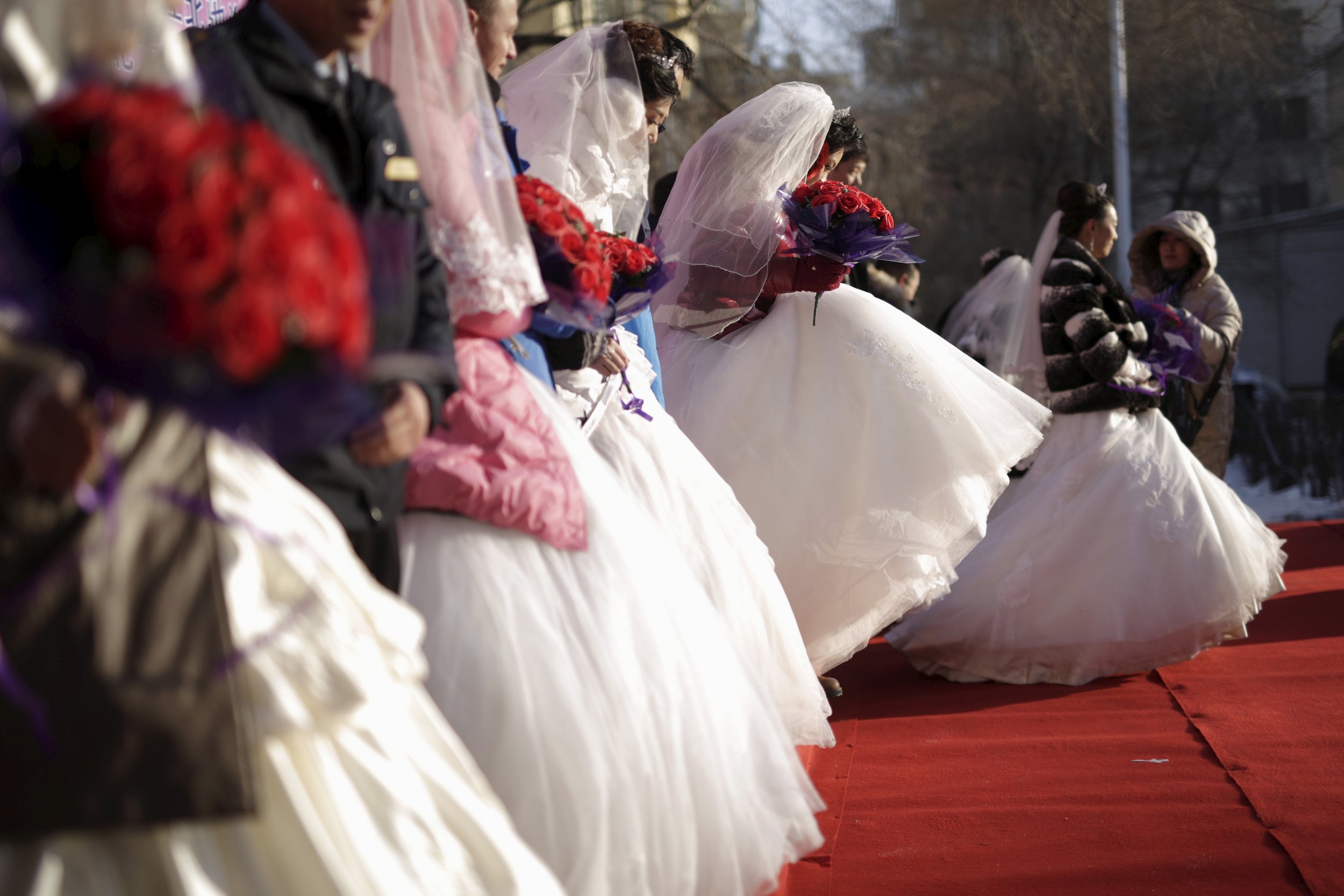 Chinese brides line up for wedding