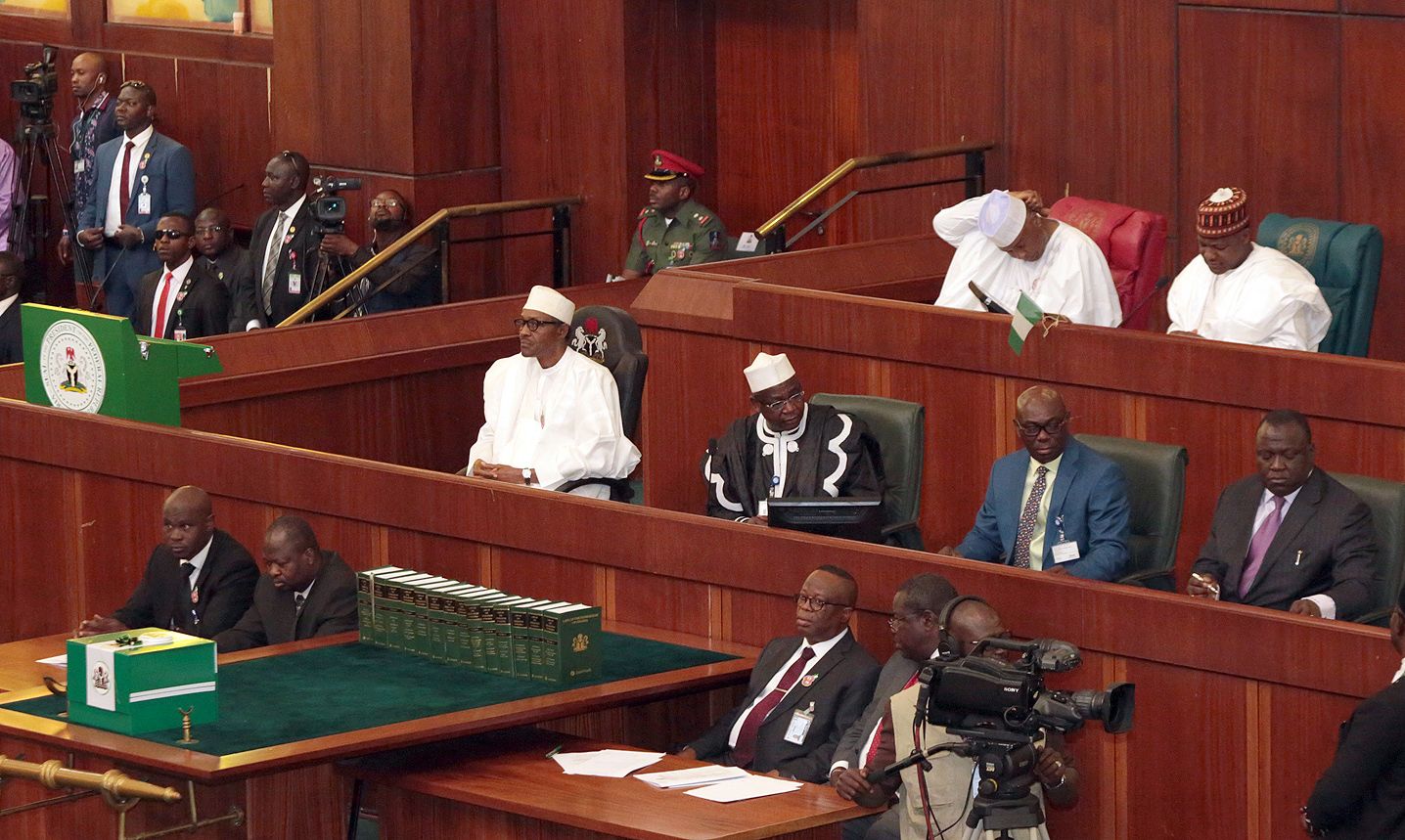 President Buhari sits in Nigeria's National Assembly after submitting his budget.