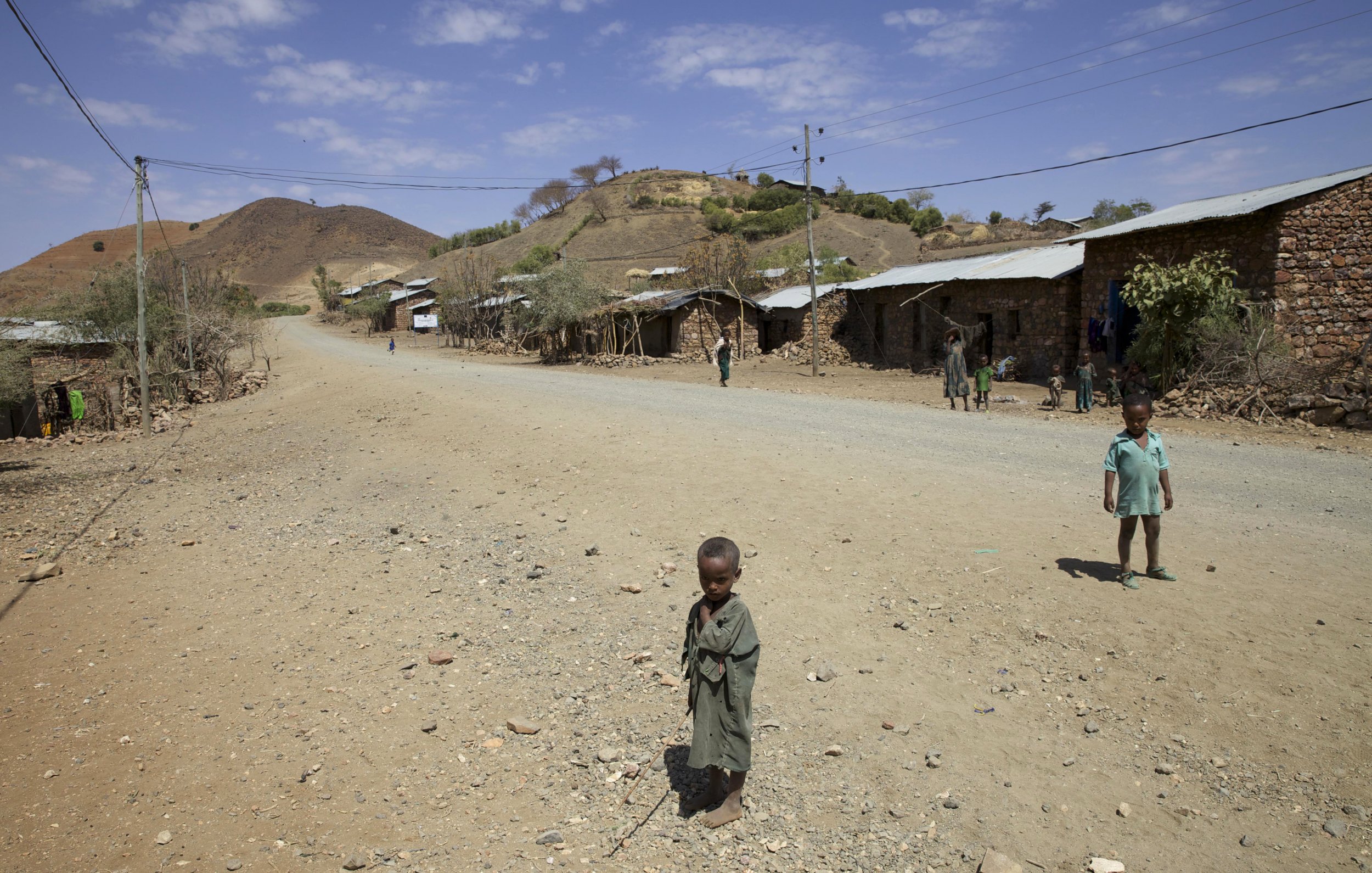 Ethiopian children stand in the road.