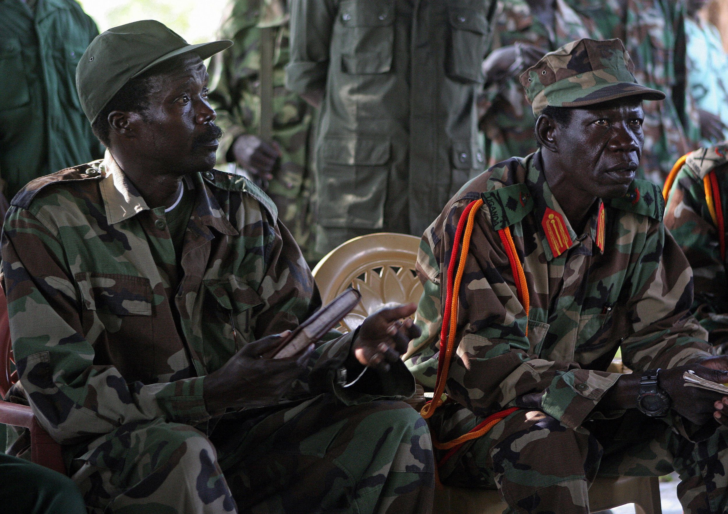 Lord's Resistance Army leader Joseph Kony sits at a meeting with a U.N. representative.