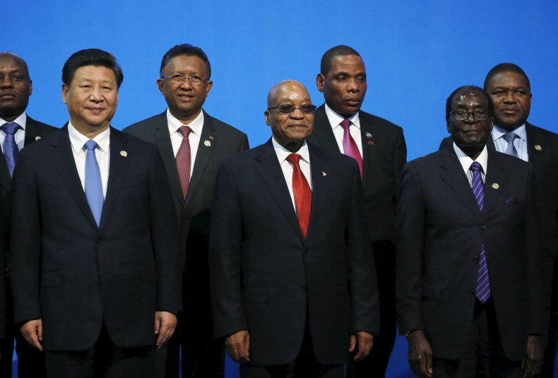 China's Xi Jinping poses with Robert Mugabe and Jacob Zuma.