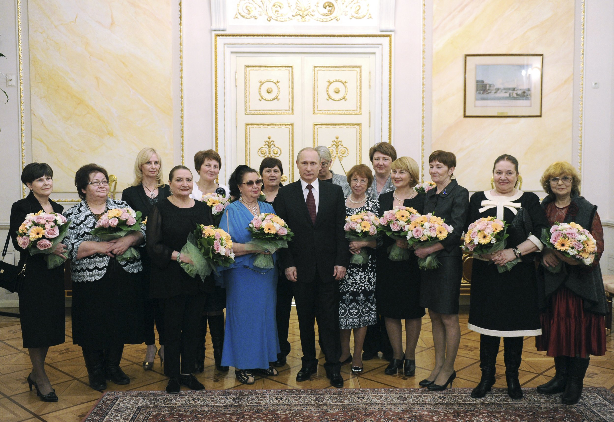 Putin stands alongside women on March 8