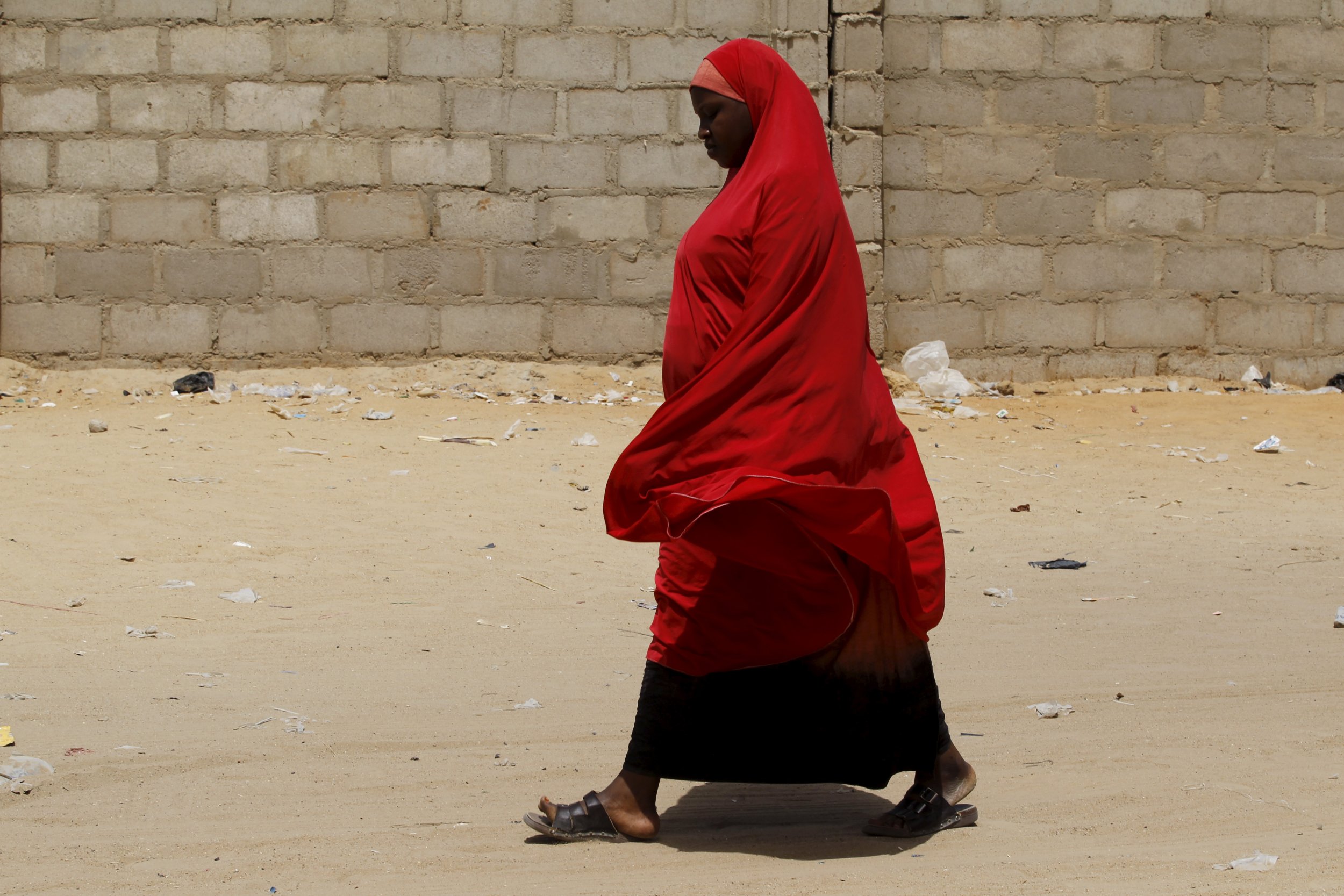 A woman walks in an IDP camp in Maiduguri, Nigeria.