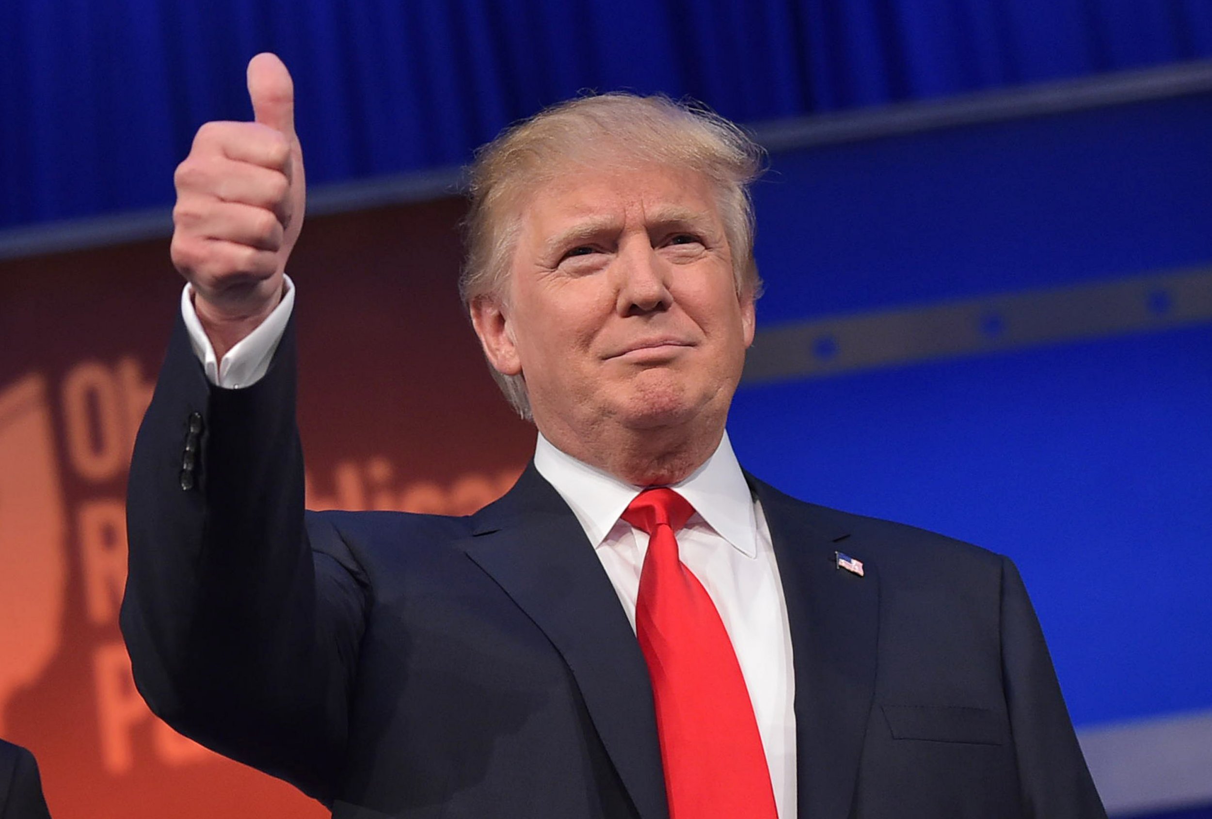 Republican candidate Donald Trump gives a thumbs-up.