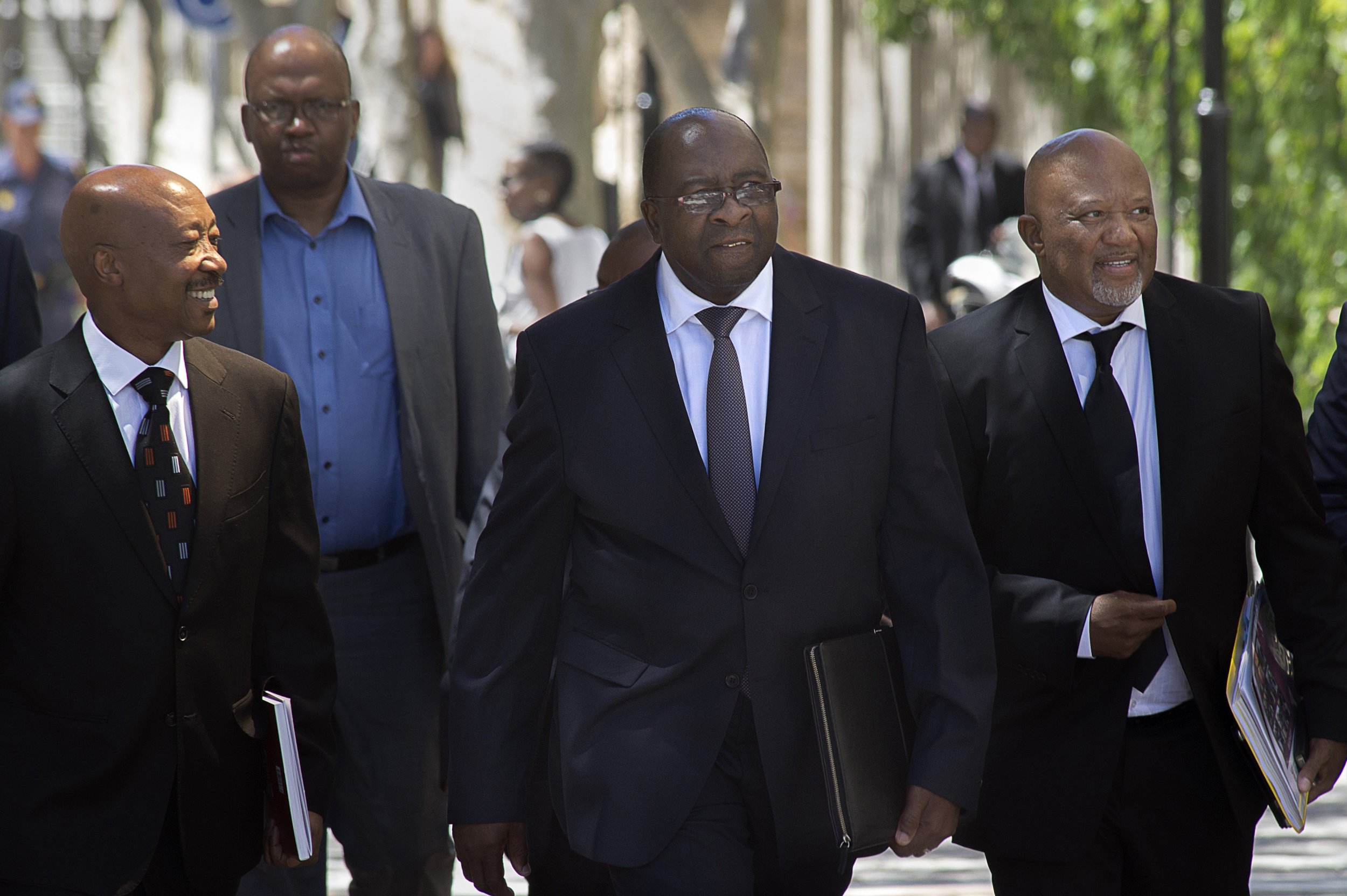 Nhlanhla Nene walks alongside Mcebisi Jonas in Cape Town.