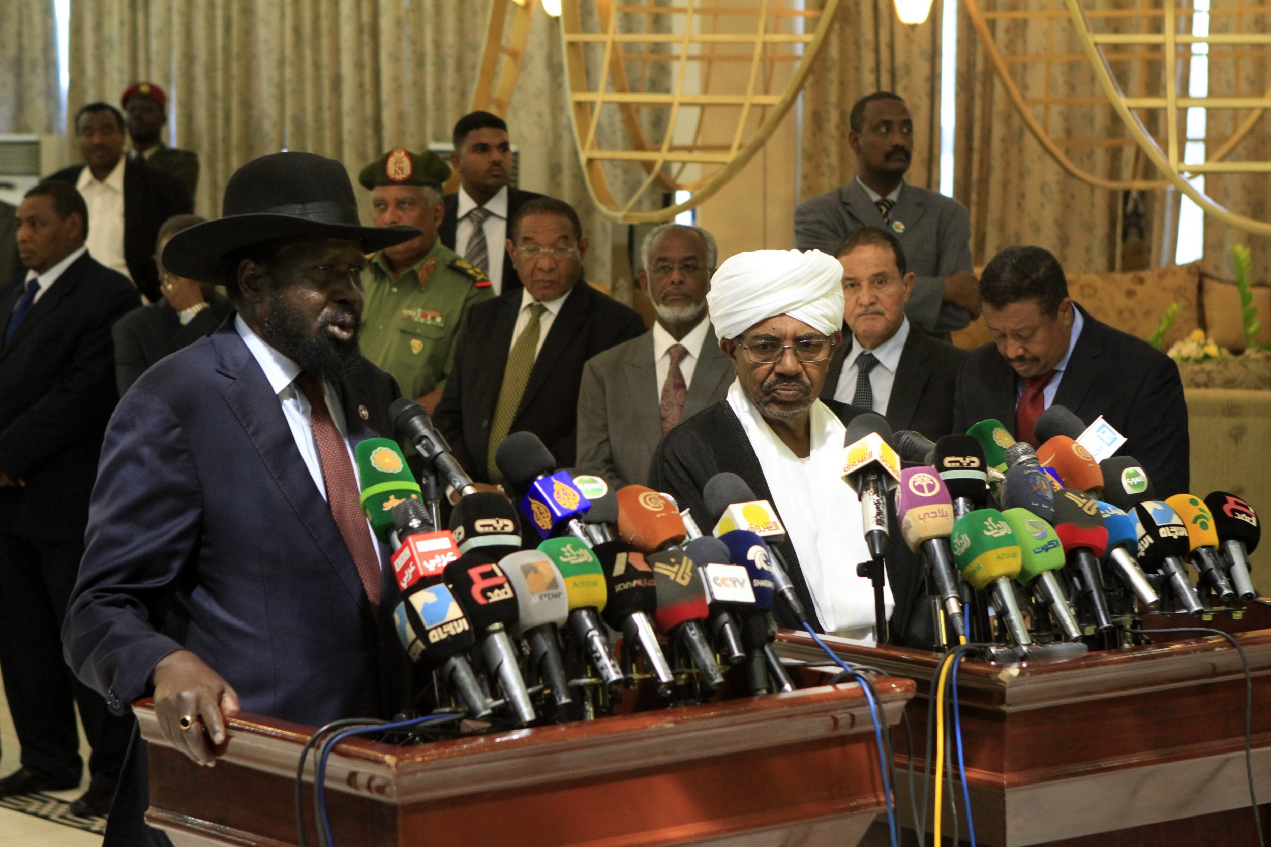 South Sudan President Salva Kiir and Sudan President Omar al-Bashir speak in Khartoum.