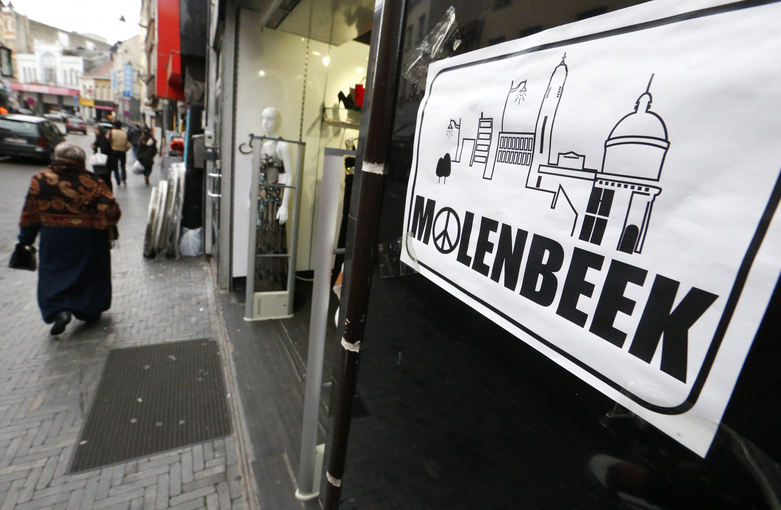 Molenbeek placard with peace and love sign in Brussels, Belgium.