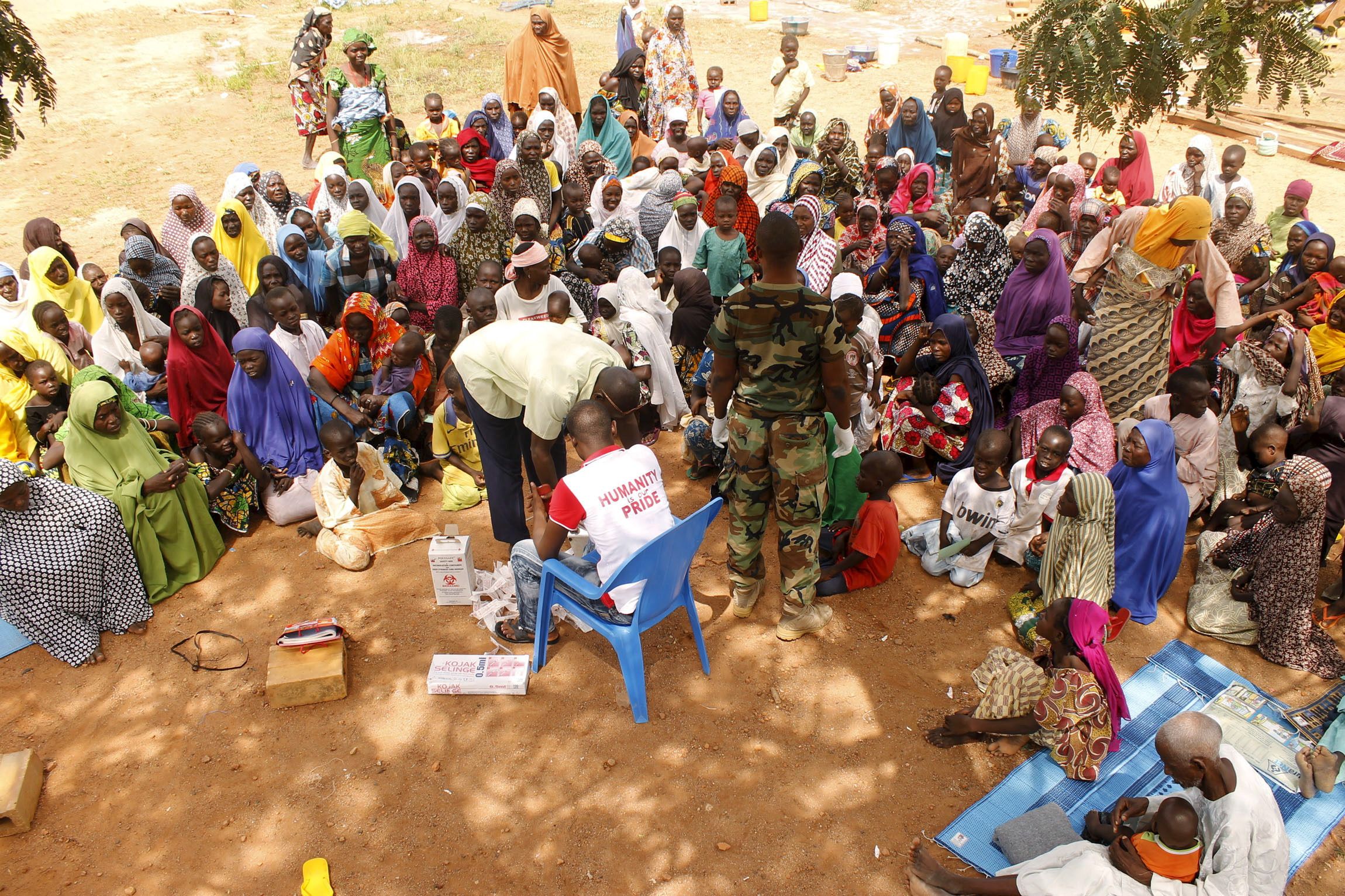 People rescued after being held captive by Boko Haram near its Sambisa Forest wait for medical treatment.