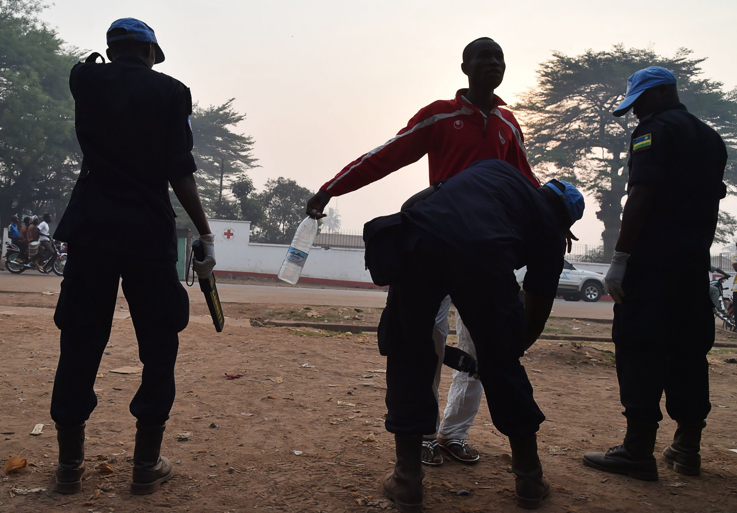 A U.N. peacekeeper checks a voter in Central African Republic.