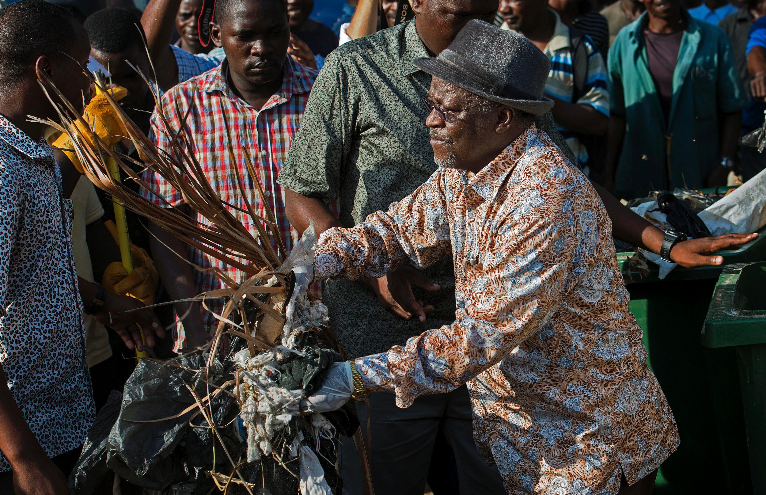 Tanzanian President John Magufuli cleans up outside the State House.