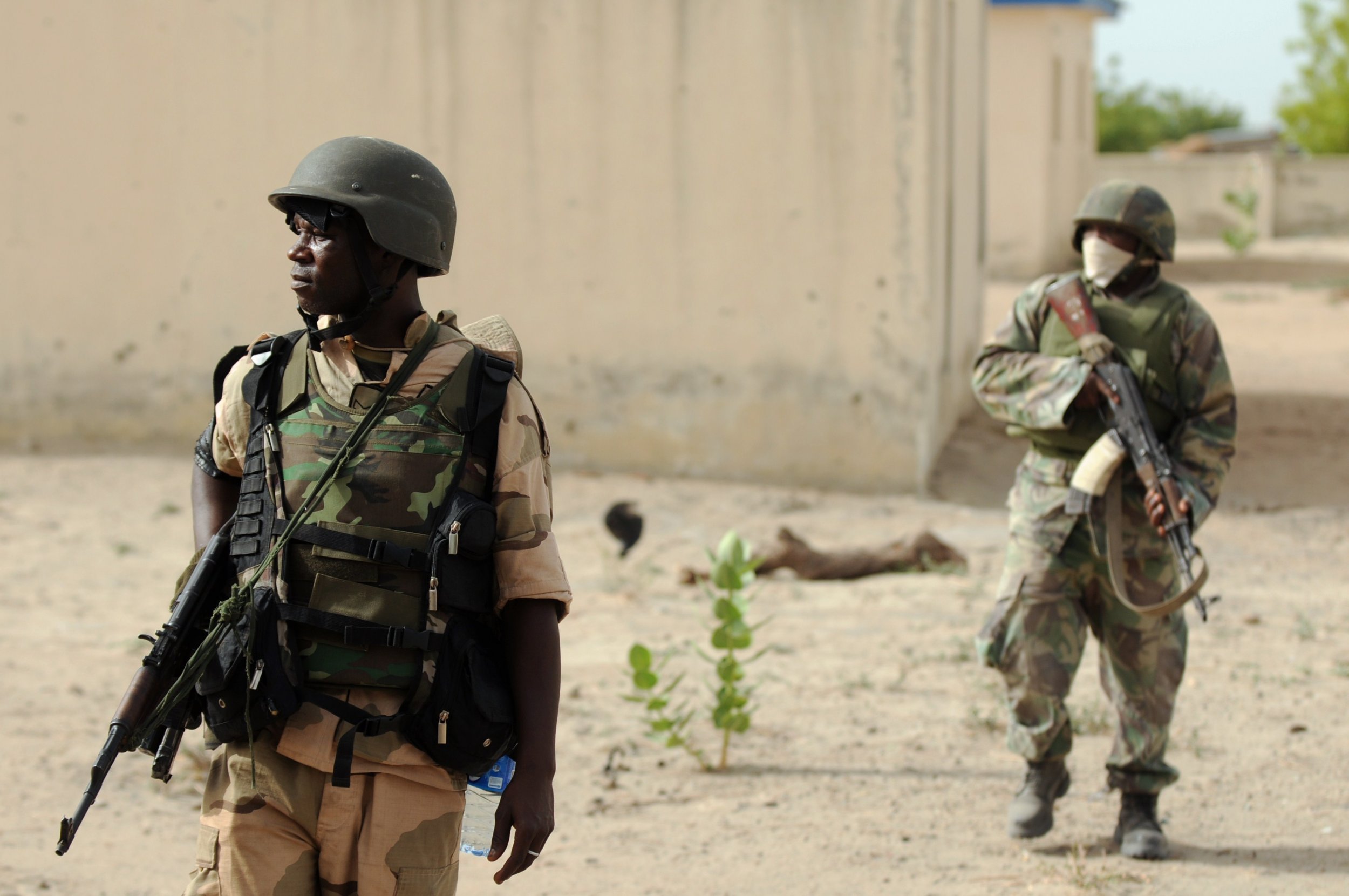 Nigerian soldiers patrol near a former Boko Haram camp in Borno.