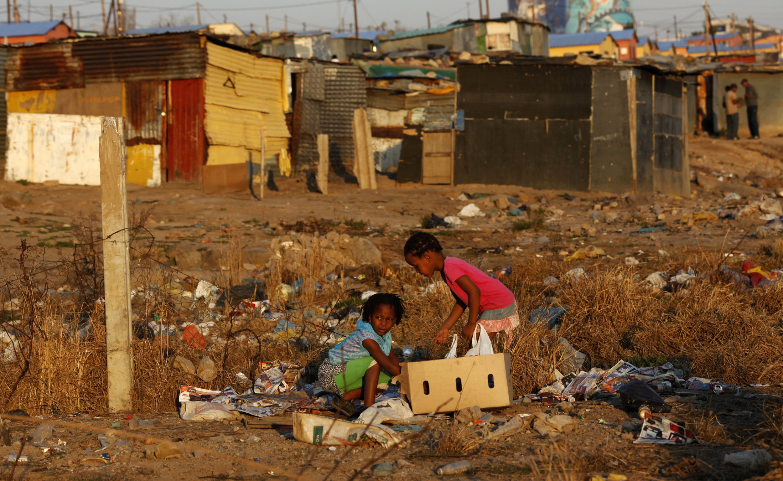 Children play at a rubbish dump in Soweto, Johannesburg.