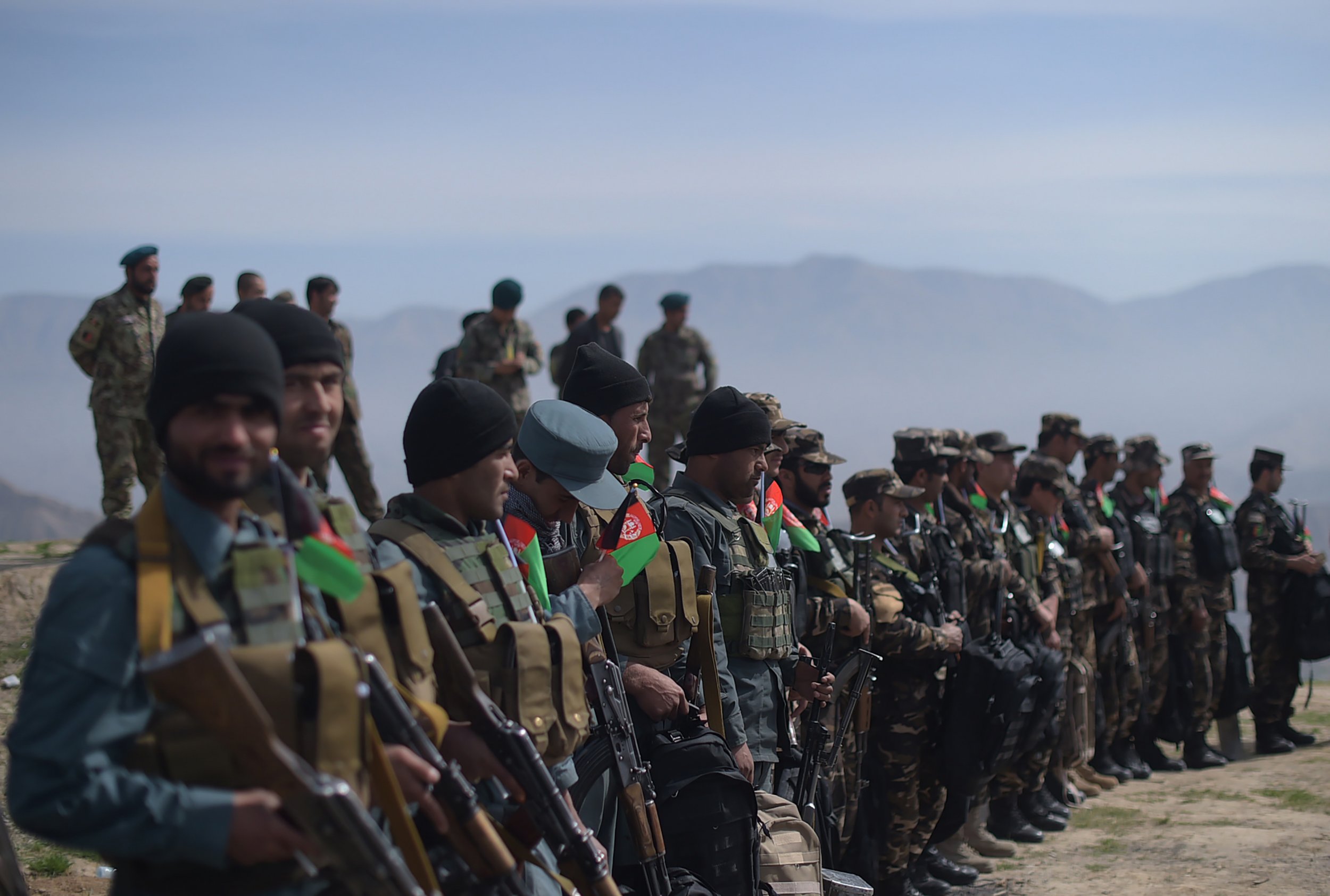 Afghan soldiers line up after weeks of fighting against the Taliban.