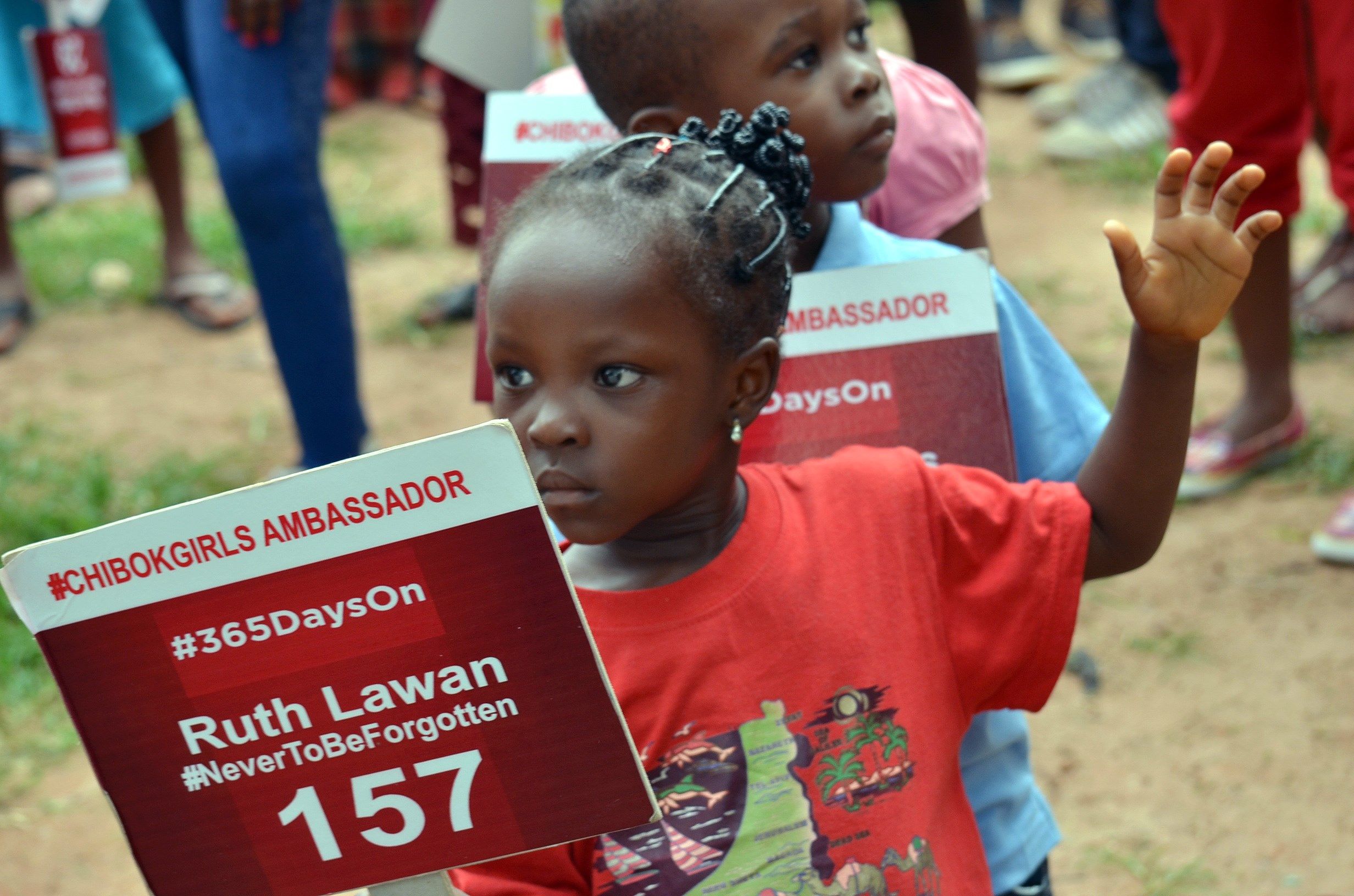A young girl campaigns for the missing Chibok girls abducted by Boko Haram.