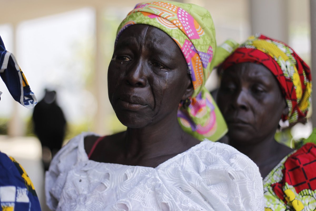 Parents of the Chibok girls weep during a meeting with President Muhammadu Buhari.