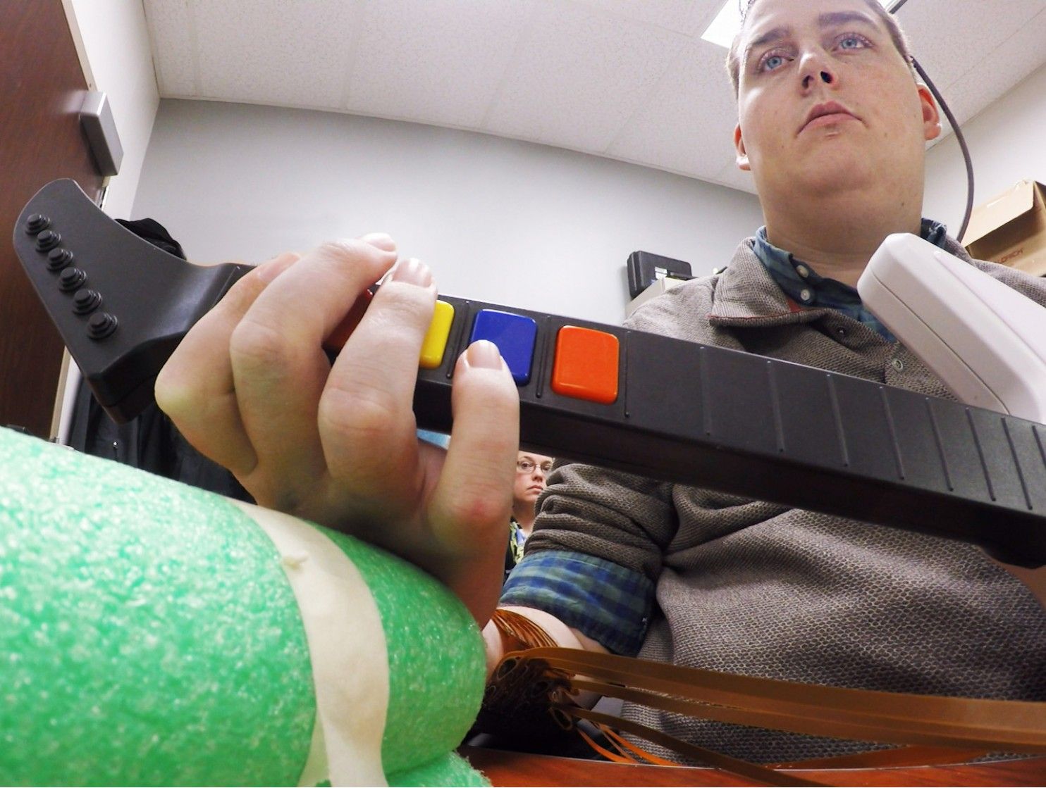 paralyzed brain chip hand guitar hero