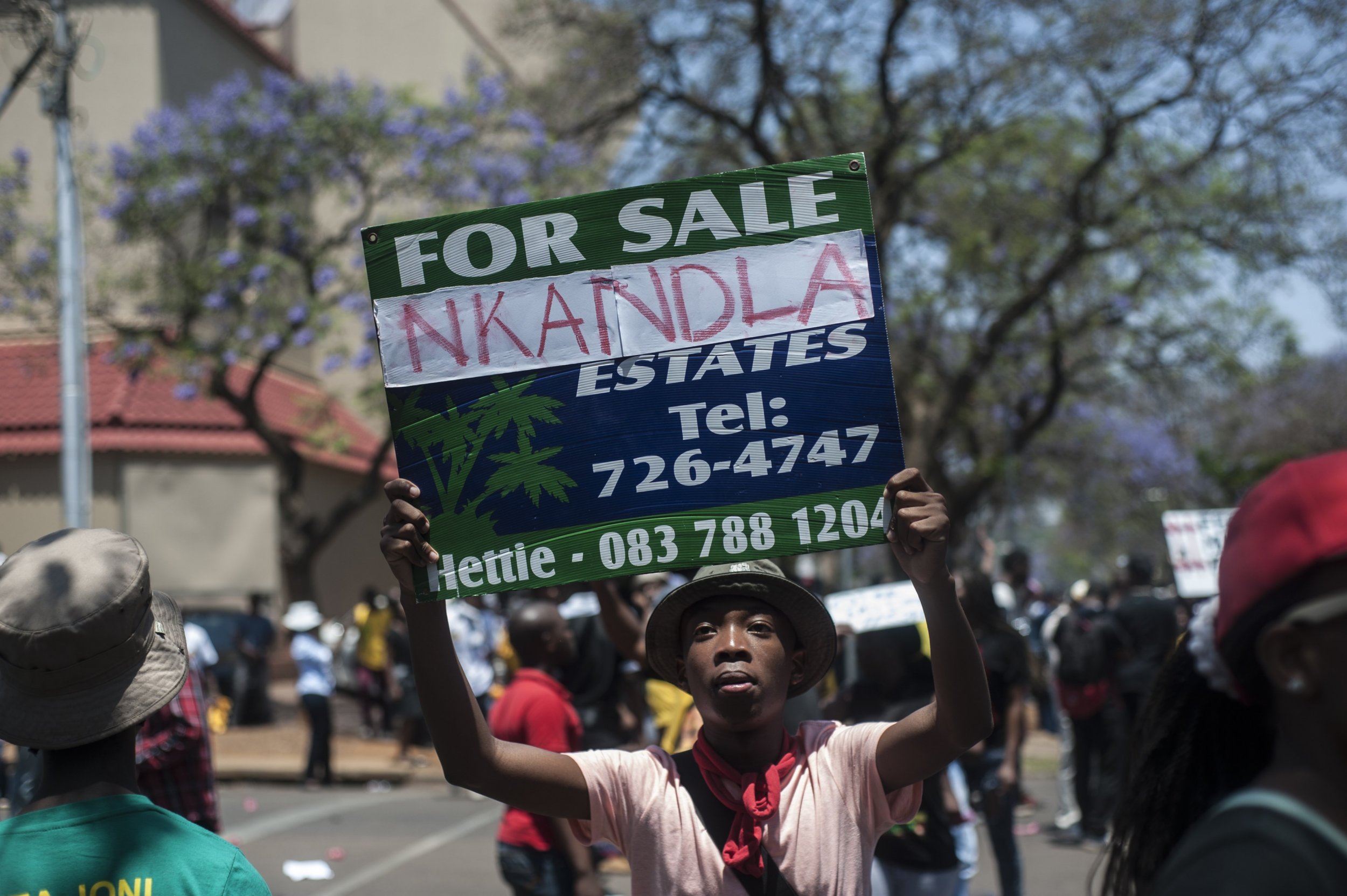 A South African protestor holds an Nkandla sign in Pretoria.