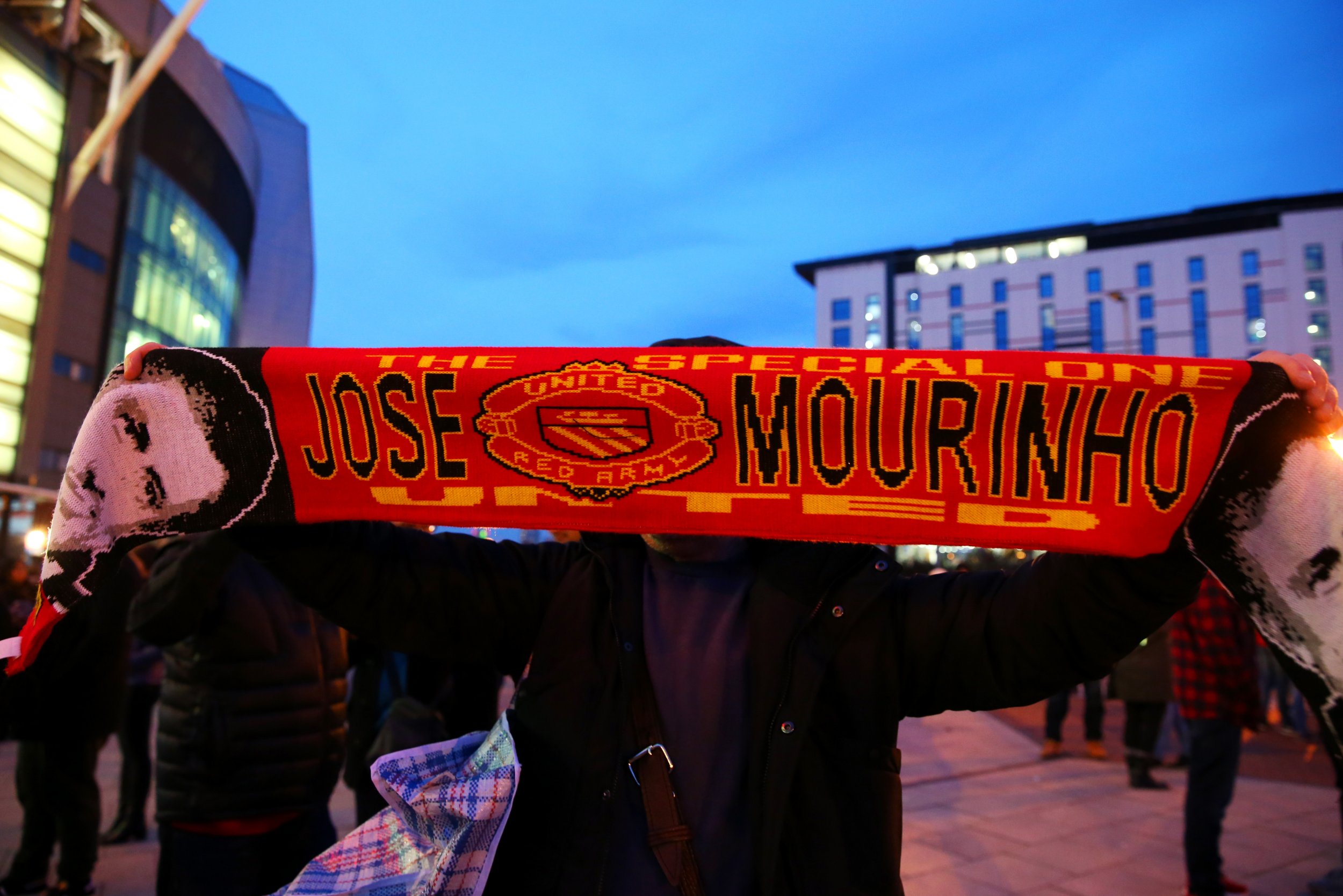 A Manchester United fan displays his support for Jose Mourinho at Old Trafford.