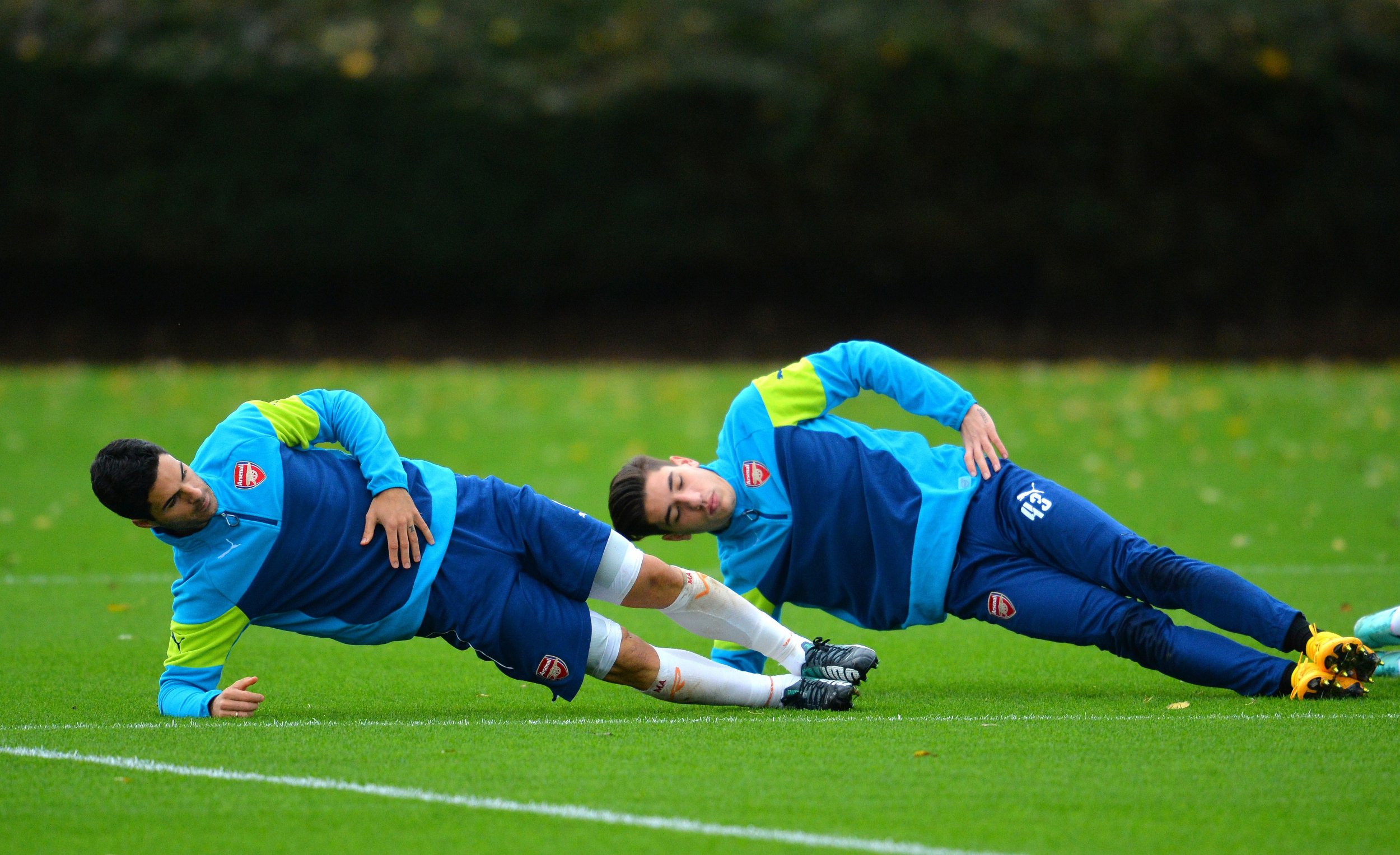 Mikel Arteta and Hector Bellerin compete in a game of head-tennis.