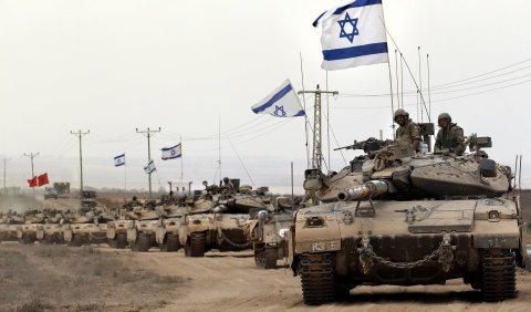 Israeli tanks return from the Gaza Strip.