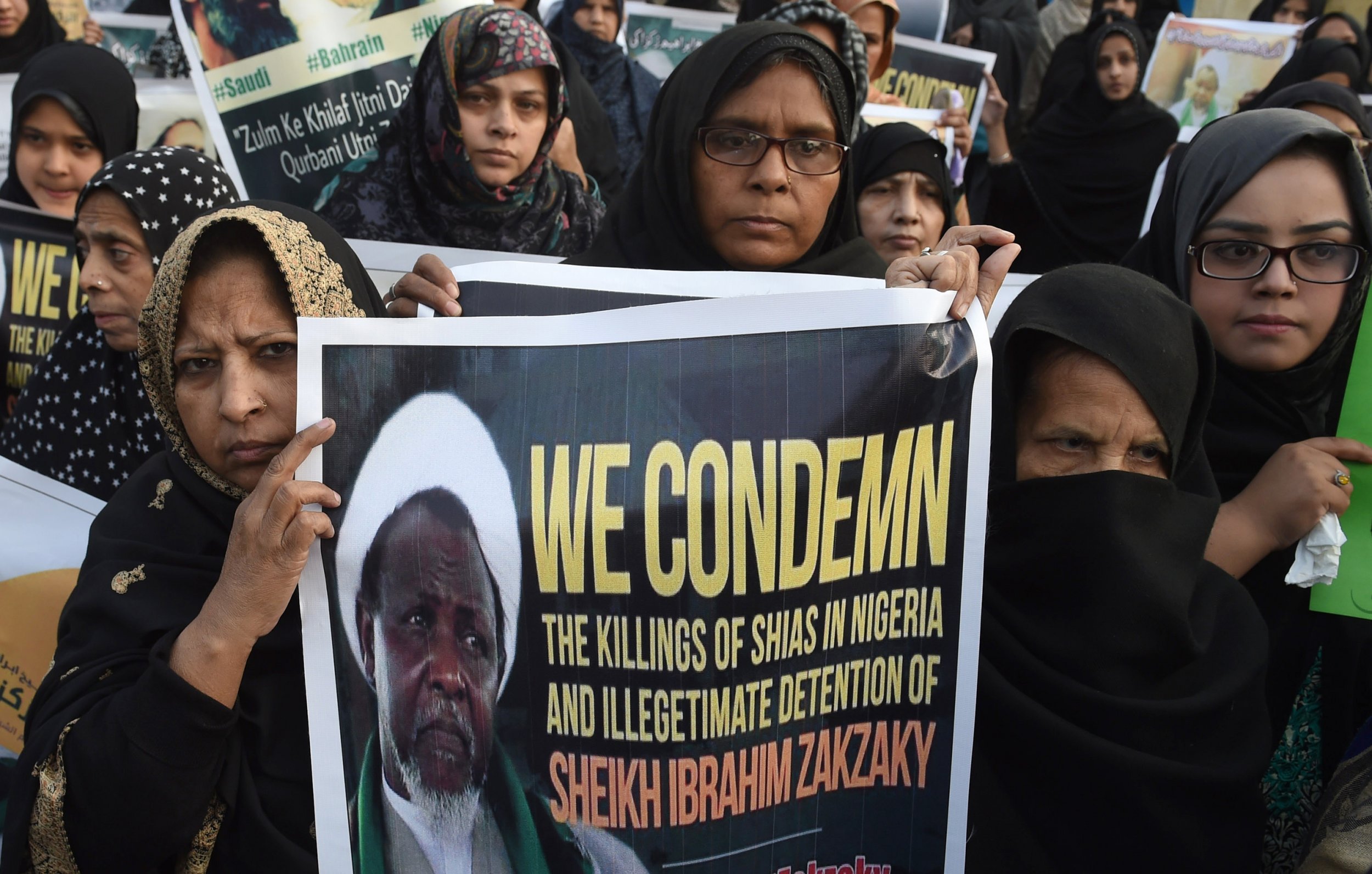 Pakistani Shiite Muslims carry Sheikh Zakzaky placard.