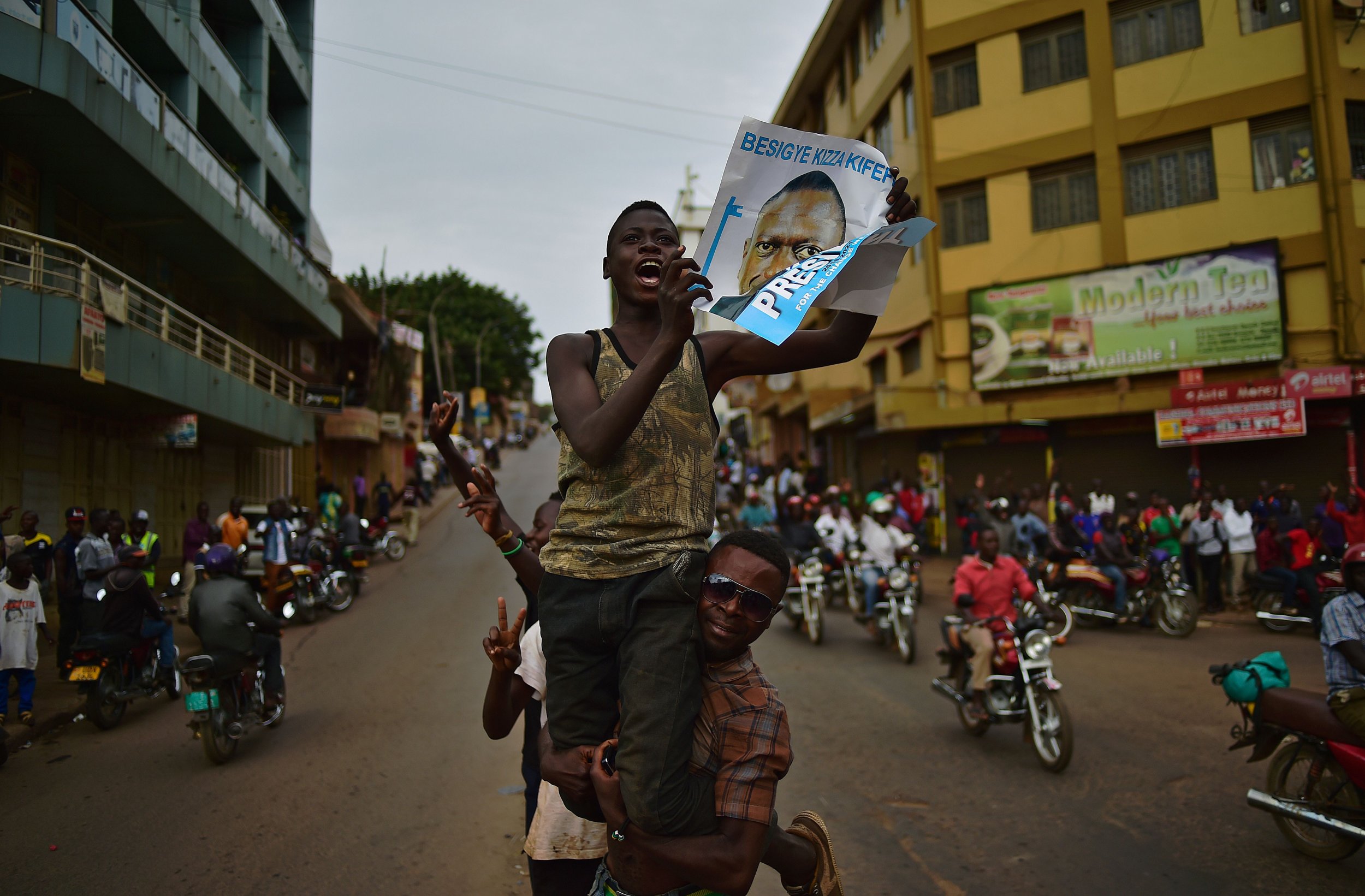 Kizza Besigye supporters cheer in Kampala.