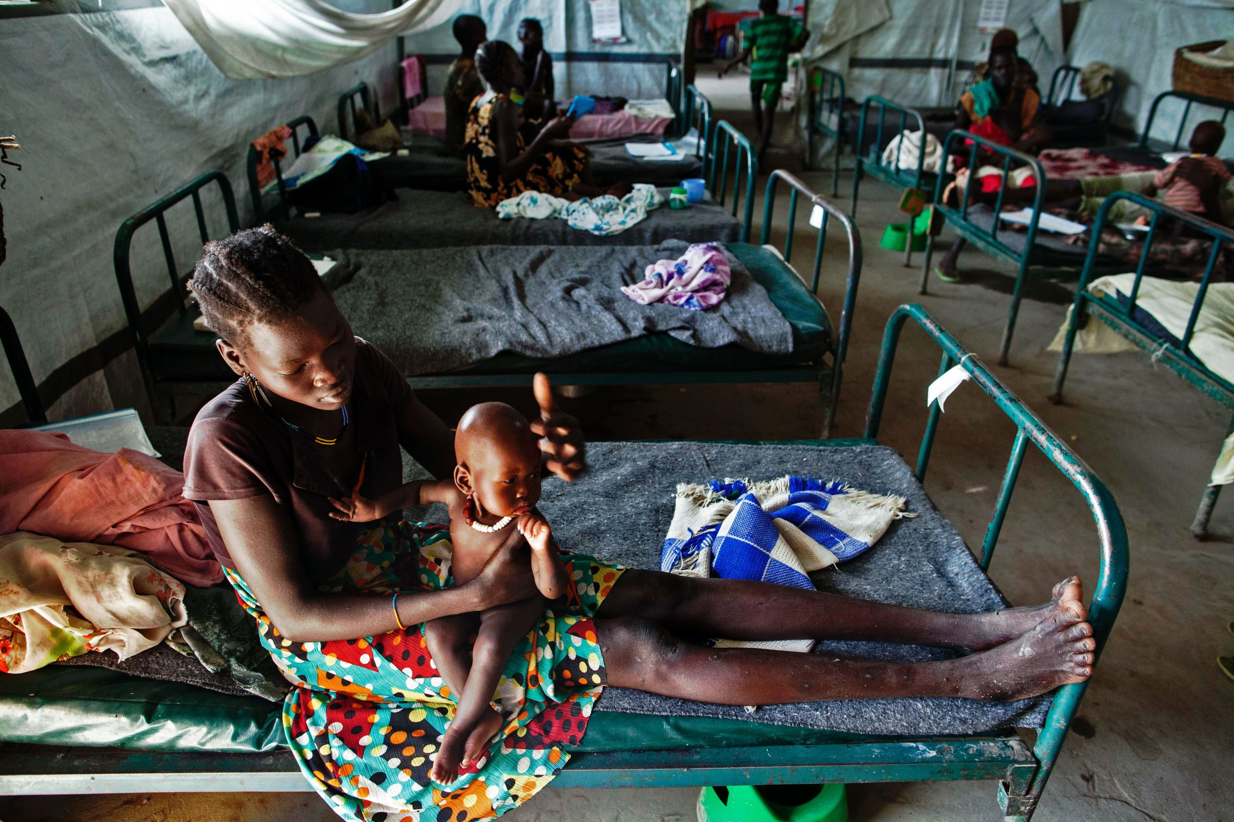 South Sudanese woman with malnourished child.