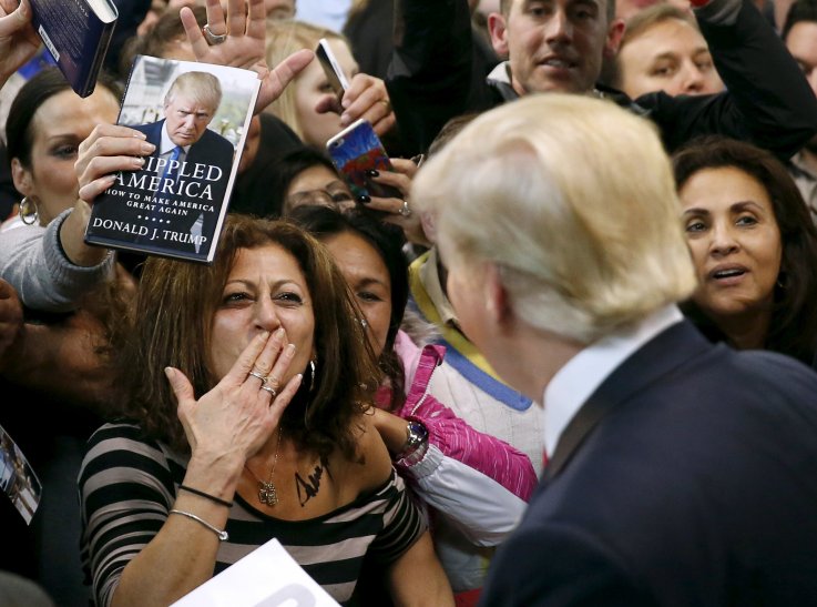 Female Donald Trump supporter blows kiss. Female Donald Trump supporter blows kiss.