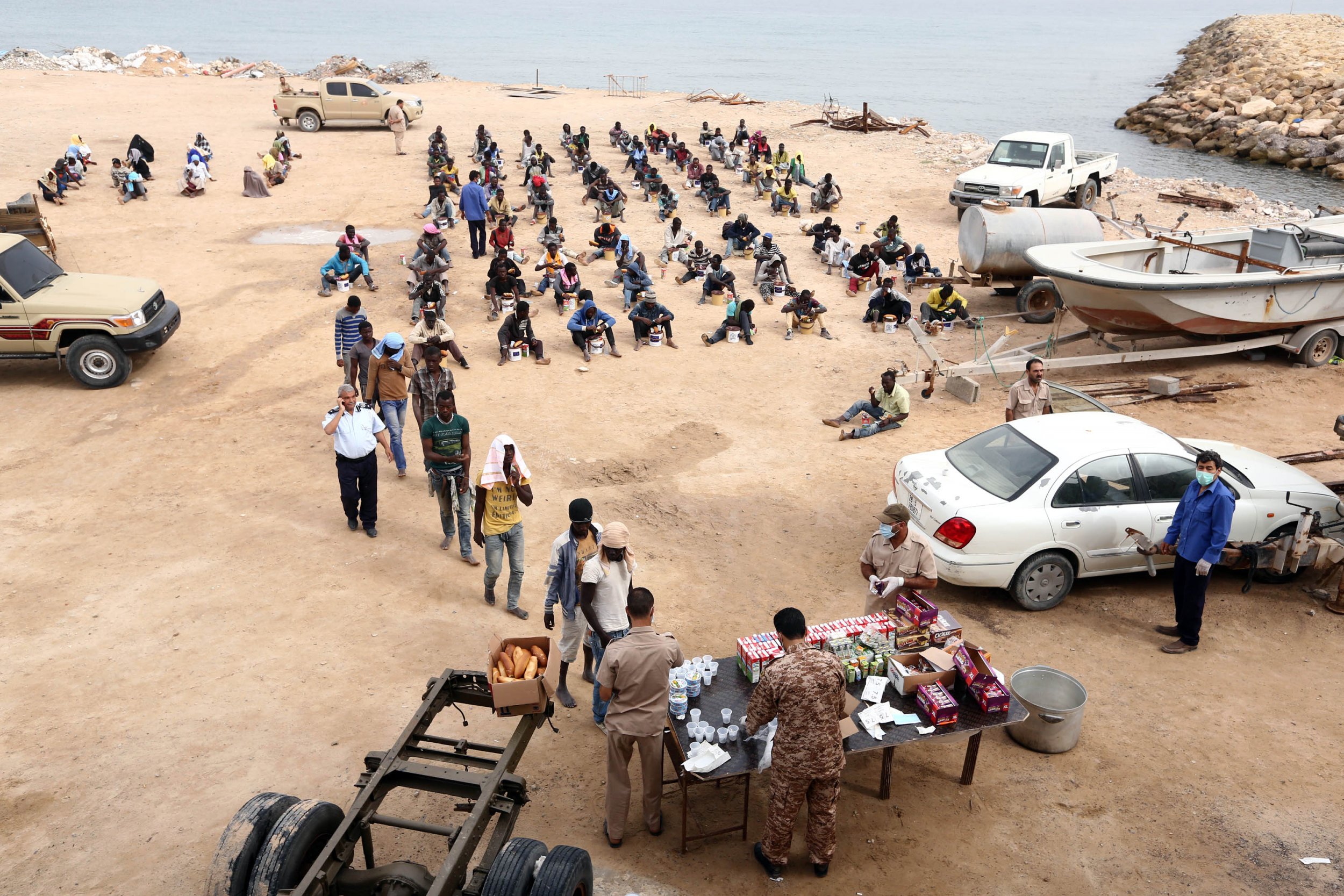 Migrants receive food in Libya