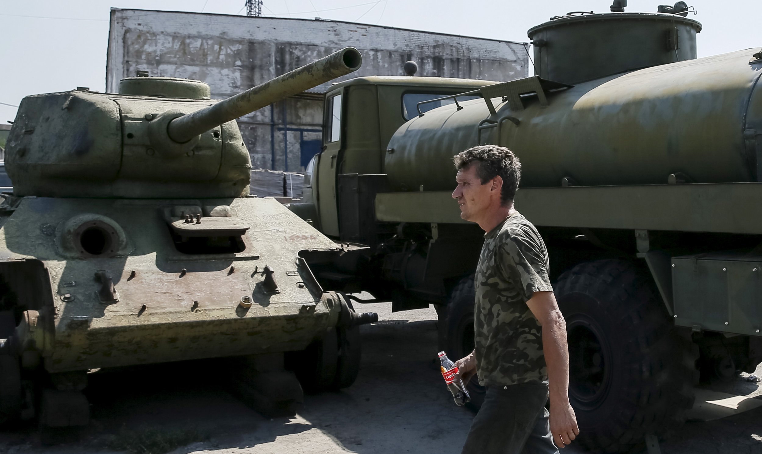 Watch: Russian Strongmen Lift Soviet 'Tank' With Bare Hands