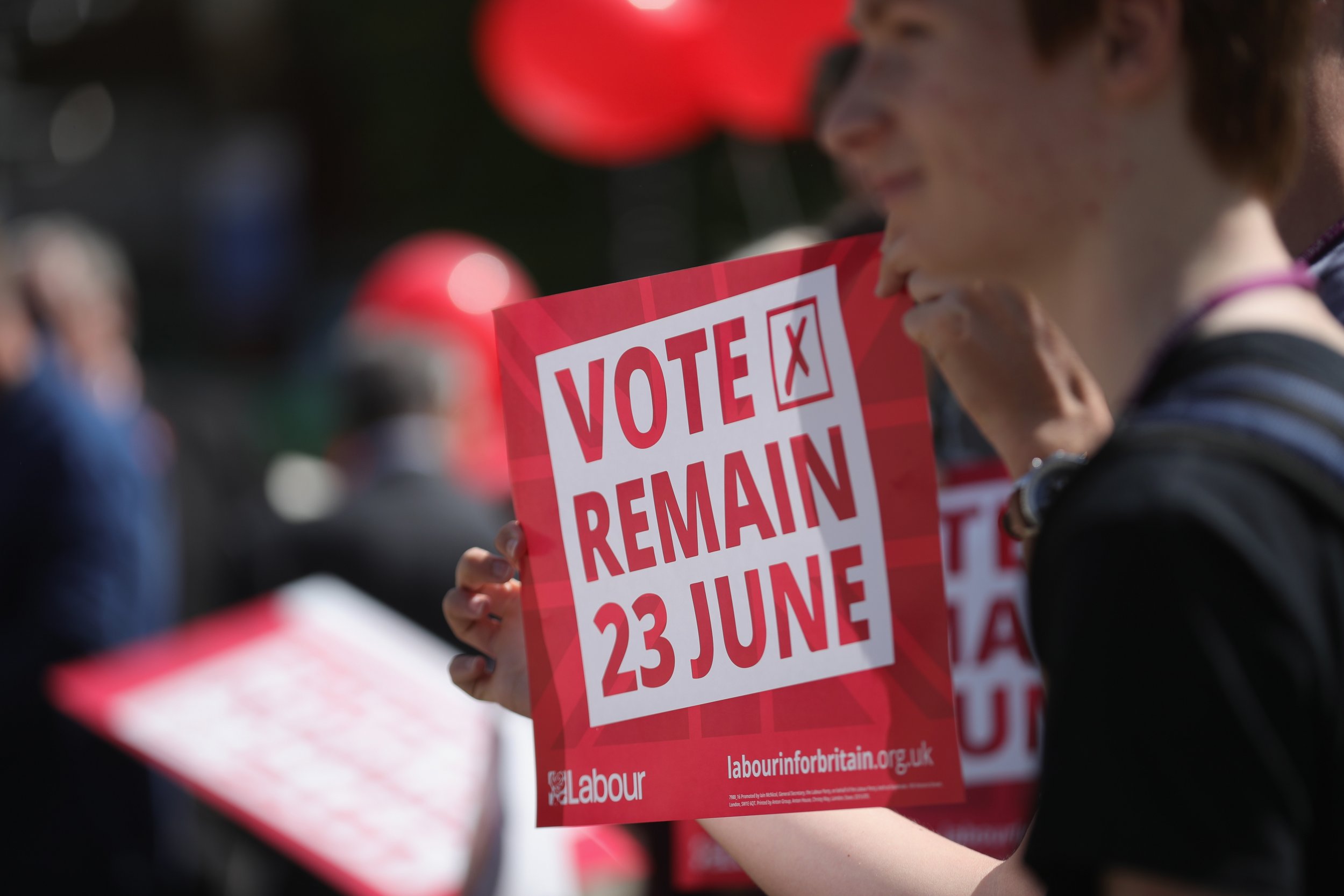 Students holding Vote Remain posters