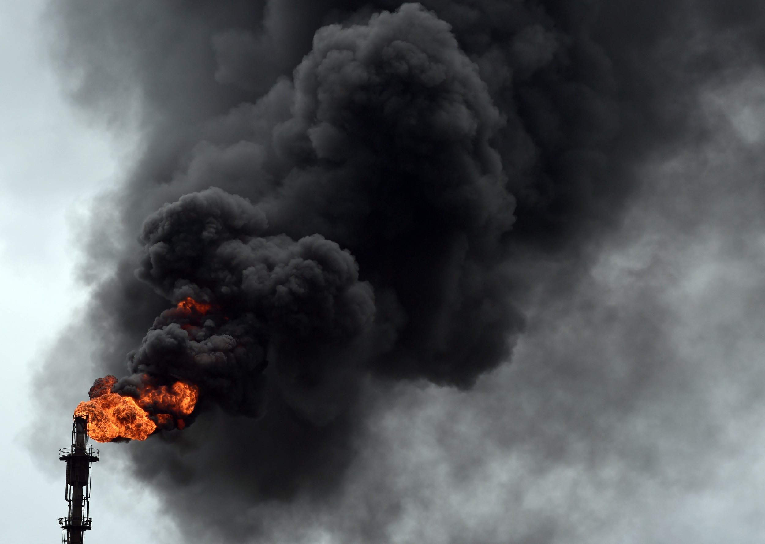 Smoke billows from Nigeria oil refinery.