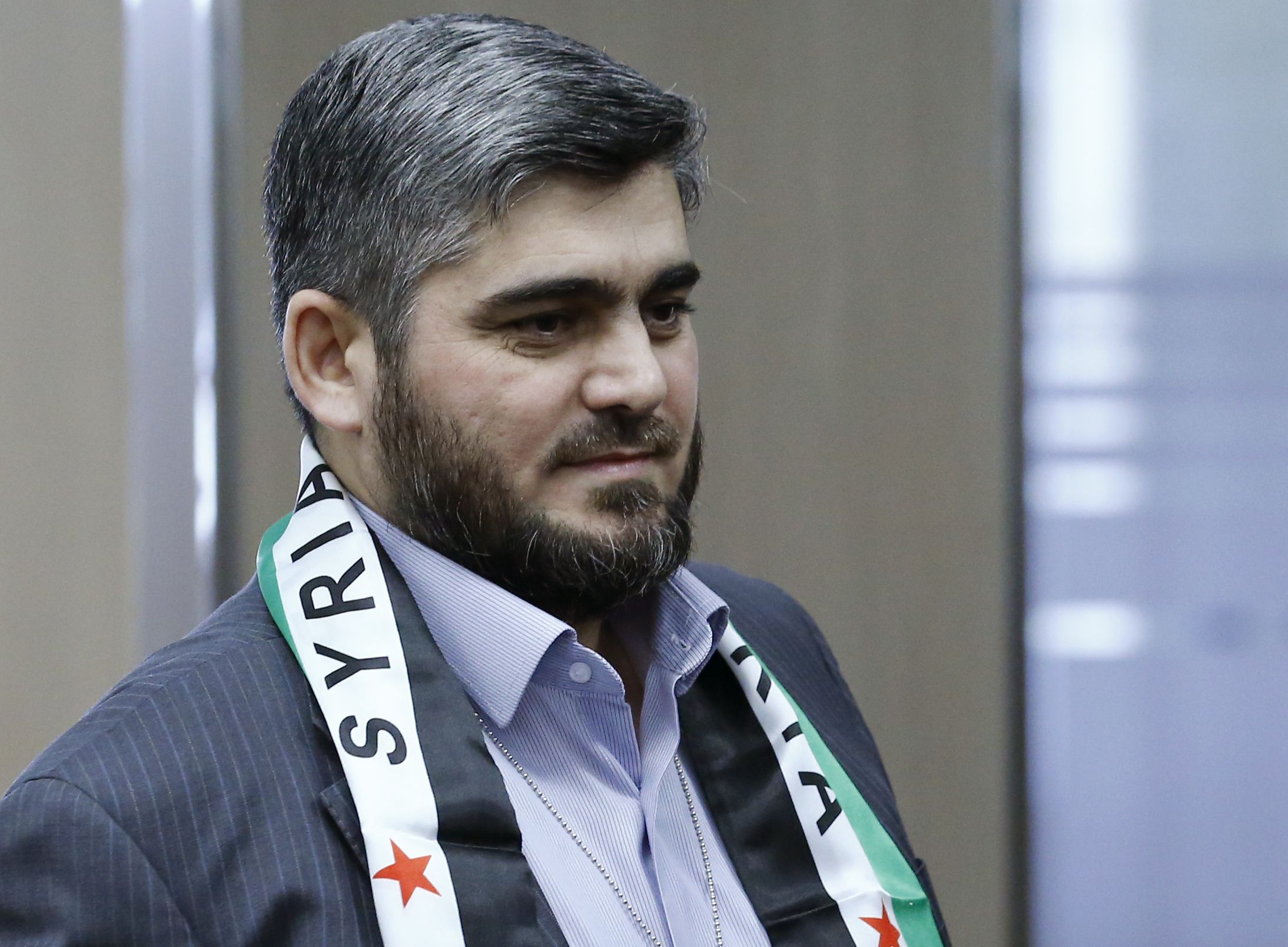 HNC negotiator Mohammed Alloush arrives in Geneva.