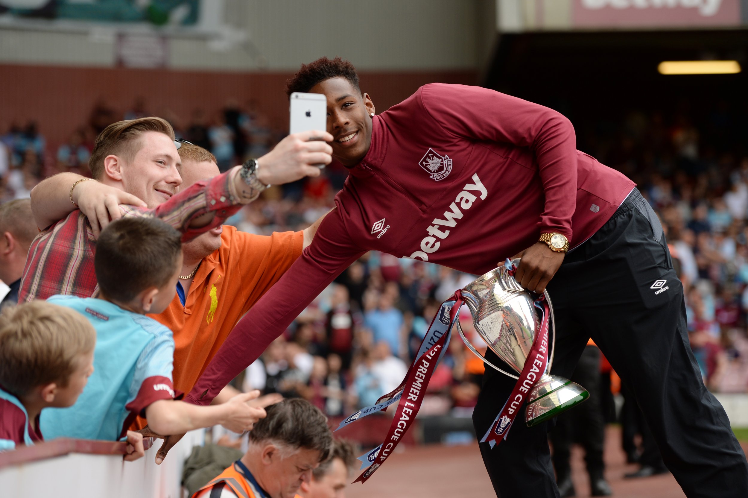 West Ham defender Reece Oxford poses with Under-21 Premier League Cup.