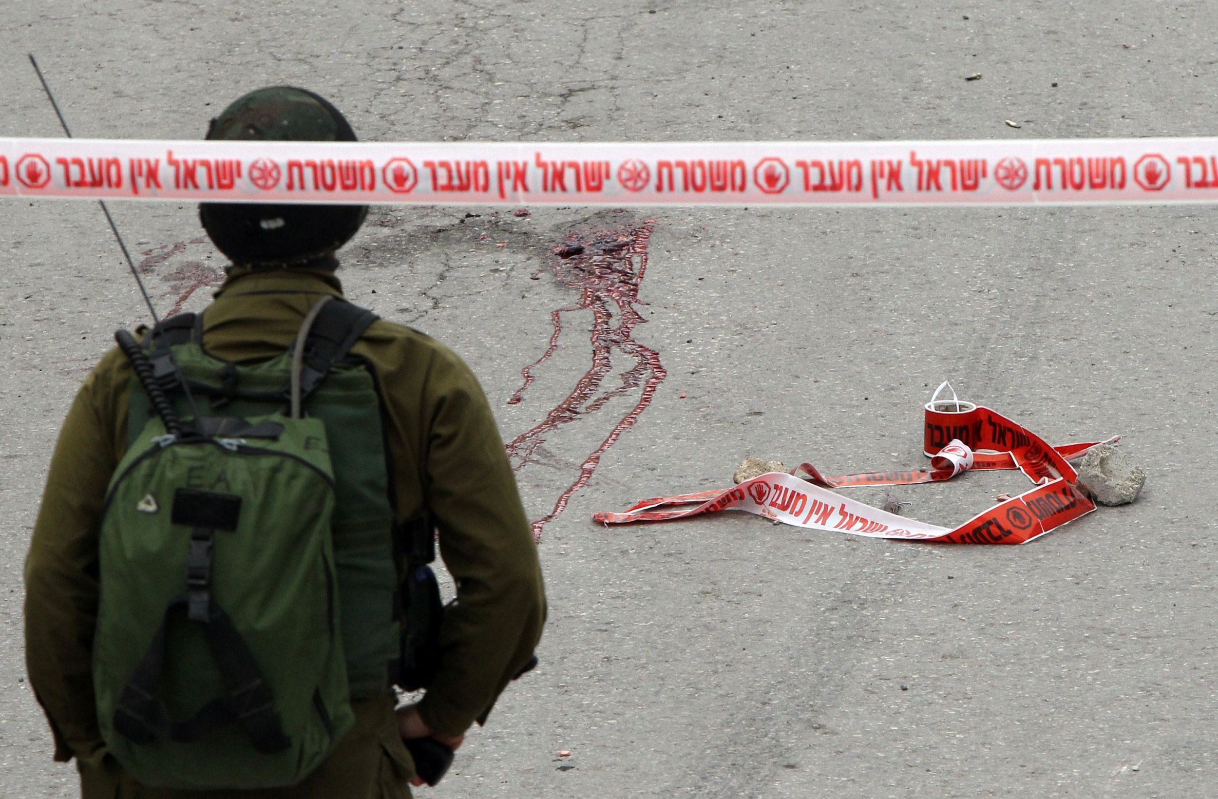 Israeli soldier at scene of a Hebron stabbing attack