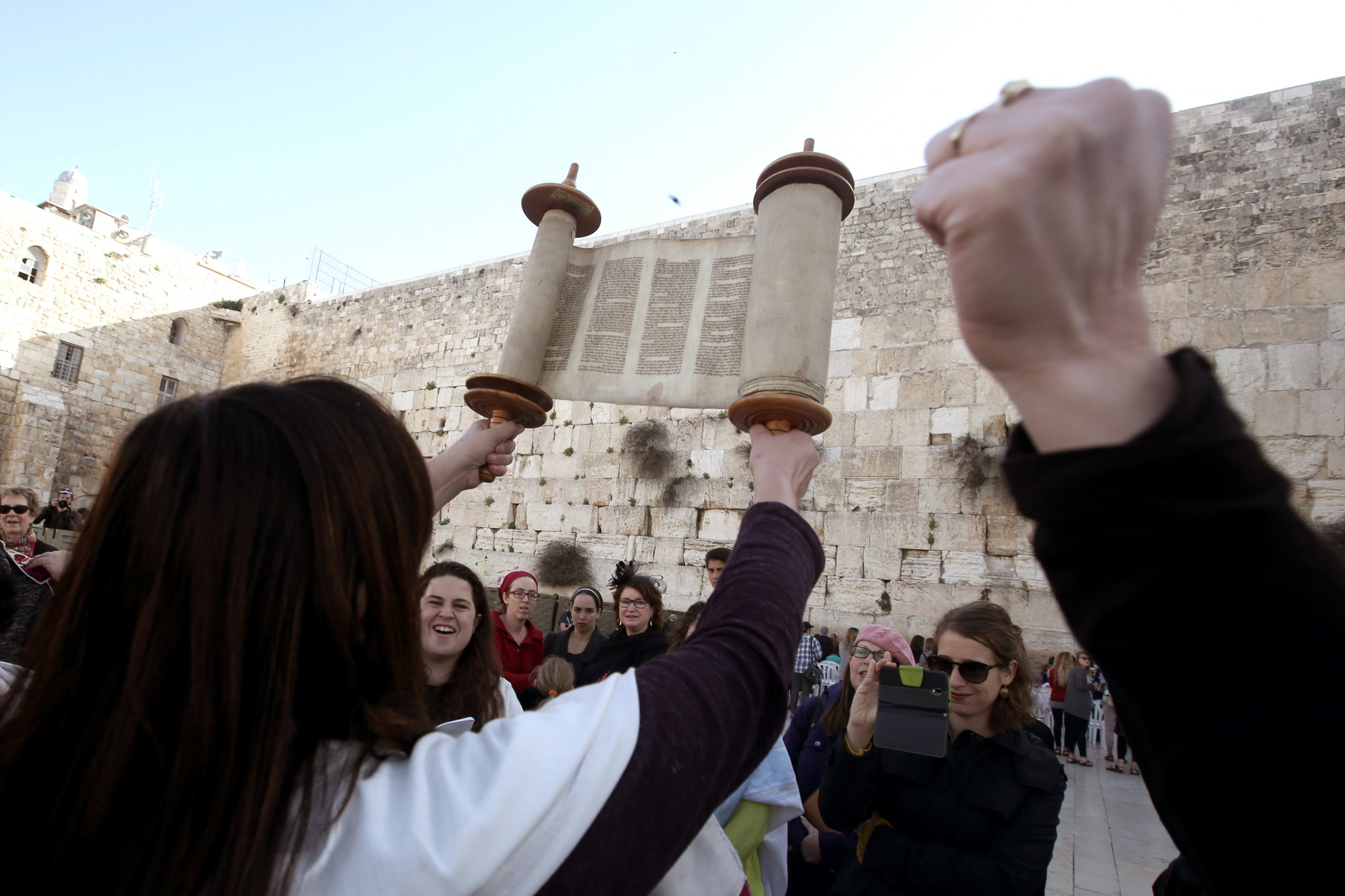 Women of the Wall hold up Torah at the Western Wall